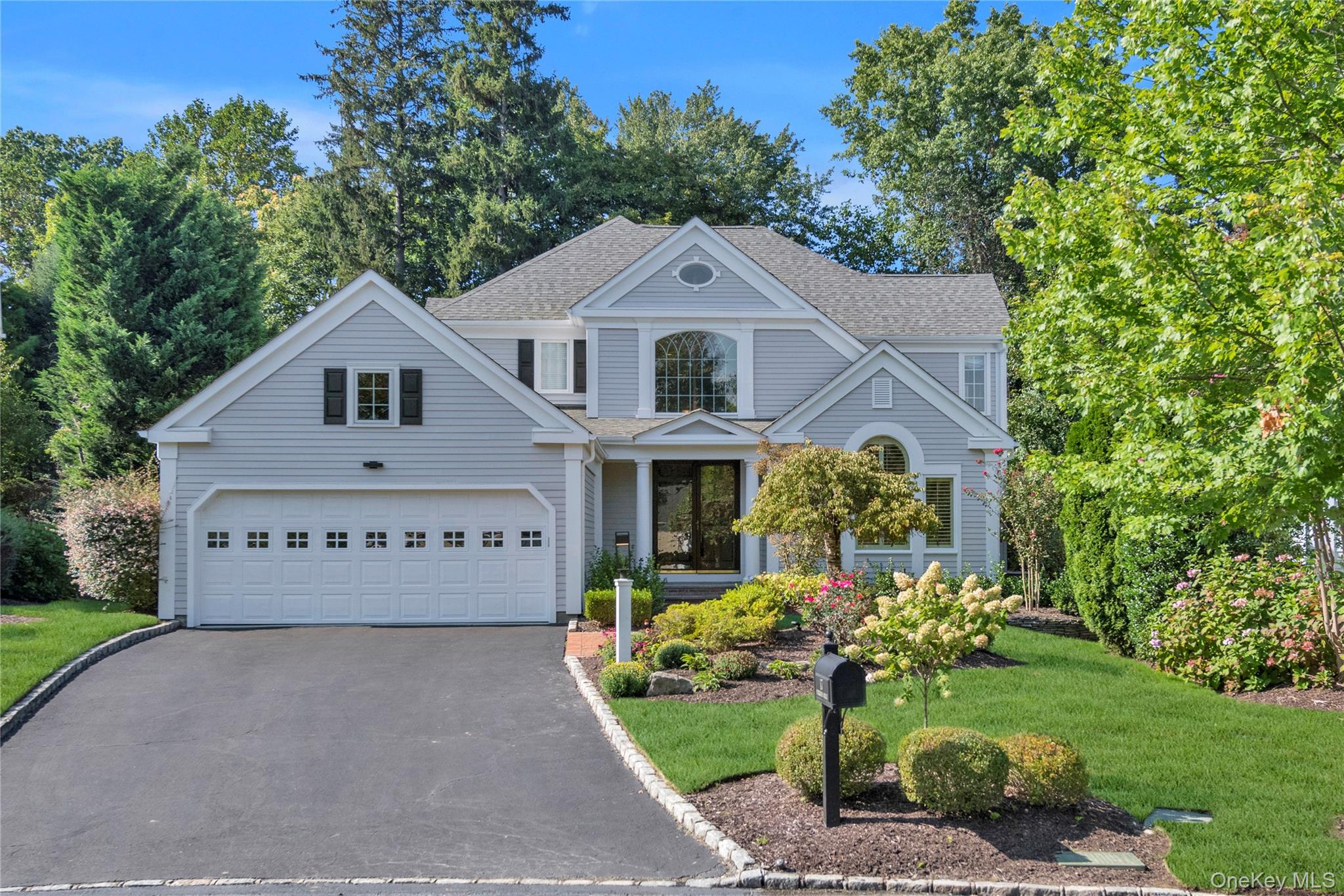 Gracewood: One of the premier gated communities in Manhasset/North Hills. This turn-key MADISON model is perfectly sited on a peaceful interior street. Everything about this 4 bedroom, 4.5 bath home exudes quality and fine design: stunning wood inspired porcelain floors, Venetian plaster walls and timeless millwork. A dramatic entry foyer opens to oversized principal rooms and sets the tone for entertaining on a grand scale. An expansive first floor primary suite features dual baths and multiple custom closets, every shopper's dream. A sweeping staircase leads to a state-of-the-art home office, three sunlit bedrooms and two additional baths. The full lower level (approx. 2000sf) offers endless possibilities for recreation. This meticulously maintained residence is for the discerning buyer who values privacy, luxury and world class club amenities: indoor/outdoor pool, tennis/pickleball courts, fitness center, party, billiard and card rooms, play ground ,indoor playroom and year round social events. Minutes to major parkways, LIRR & the renowned Americana Shopping Center.