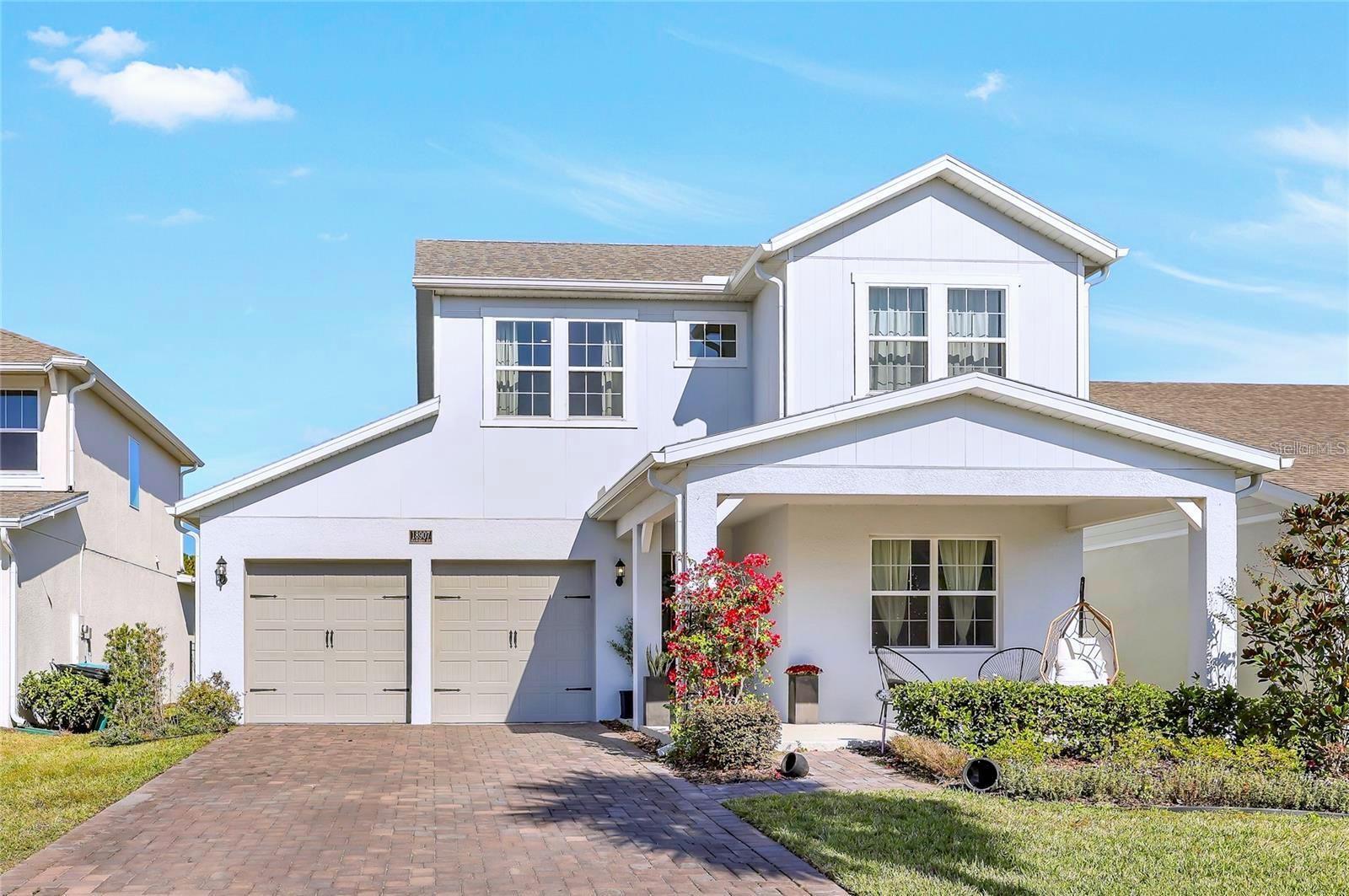 MAJOR PRICE IMPROVEMENT! A stylish Orlando home where comfort meets convenience. This updated two-story layout features the primary suite on the main floor along with a bonus office for working from home, studying, or flex living — plus a convenient powder room for guests. Upstairs, two additional bedrooms and a full bath provide privacy for family, visitors, or long-term stays. The second story includes simple attic access for extra storage. You'll love the trendy finishes, fresh modern atmosphere, and full interior repaint scheduled before closing. The garage has been transformed with designer-grade full flake epoxy flooring, and the backyard opens to peaceful conservation views — no rear neighbors to interrupt your Florida sunsets. Nestled in a community with a pool and lakefront dock and positioned minutes from the airport, dining, major highways, and iconic theme parks — this home offers the best of location, lifestyle, and value.