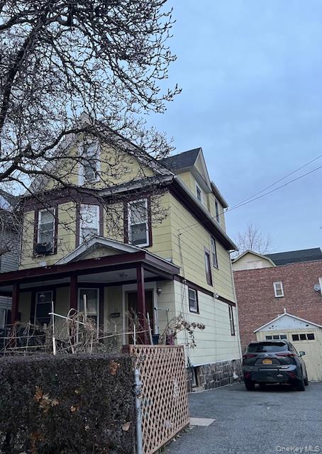 Step back in time with this beautiful home built in the early 1900s, full of character and old-world charm. This spacious three-level house features six large bedrooms and two full bathrooms, offering plenty of room for everyone. You will love the hardwood floors that run throughout the home. The main floor includes a cozy living room for relaxing and a formal dining room perfect for big family meals or holiday gatherings. With its classic style and welcoming feel, this historic treasure is ready for you to move in and make it your own. Conveniently located near transportation, shopping, schools and restaurants.