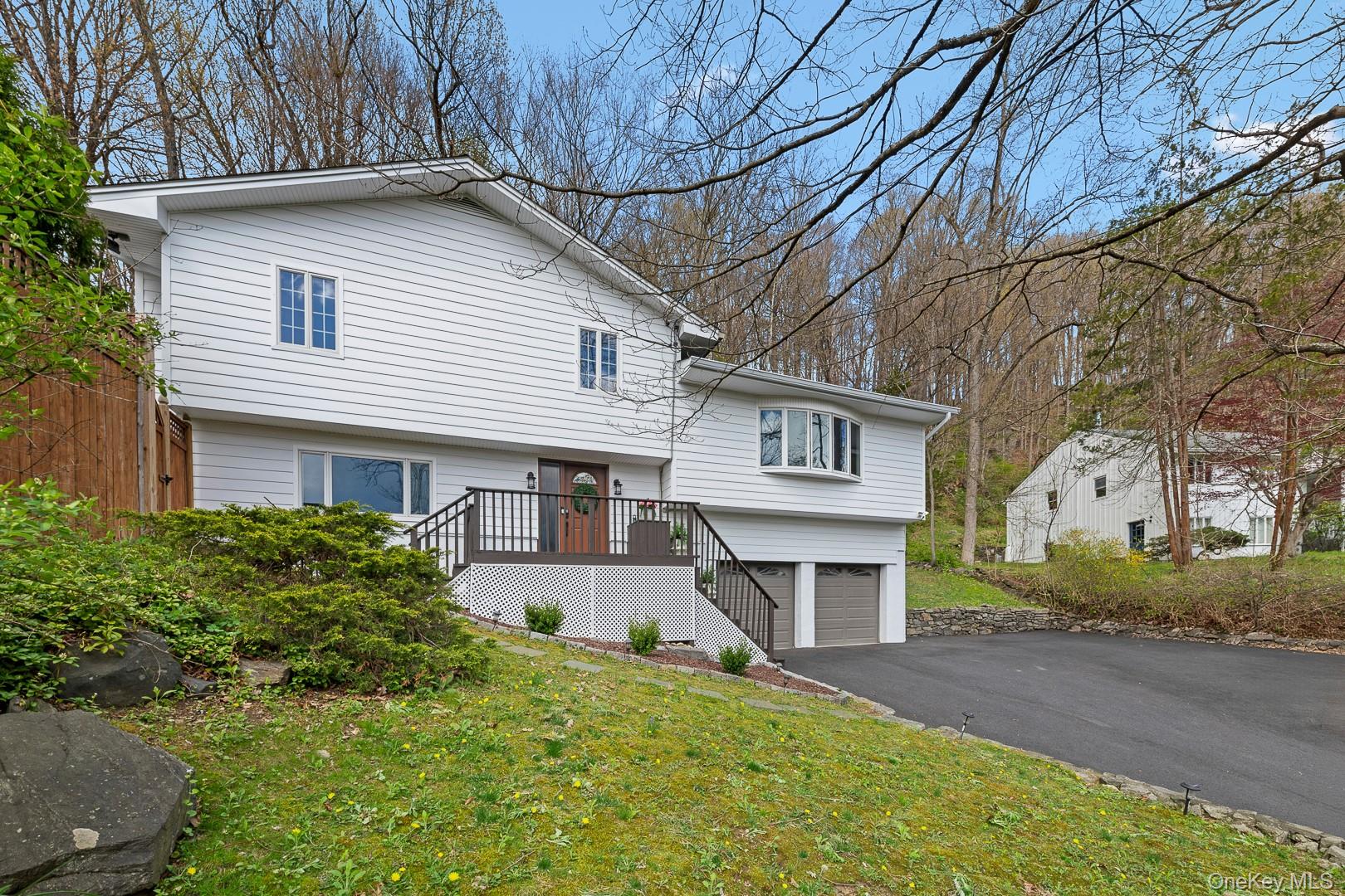 Experience the perfect blend of modern sophistication and outdoor luxury in this stunning 3-bedroom, 2.5-bathroom home. The interior shines with beautiful hardwood flooring and recessed lighting throughout, featuring an updated kitchen, a formal dining room, and a cozy family room with a wood-burning fireplace. Retreat to the primary suite complete with a stylishly updated en-suite.Outside, your private oasis awaits. Step out onto a freshly stained deck that leads to an above-ground pool site ready for your summer setup, complemented by an adjacent play area. Evenings are best spent gathered around the dedicated firepit, the perfect spot for roasting marshmallows and relaxing under the stars.Exceptional curb appeal and peace of mind are guaranteed with a newly re-paved driveway, Alside Ascend composite siding (Hardie board style), and a roof and gutters that are all less than 10 years old. This turnkey gem is ready for you to move in and enjoy!