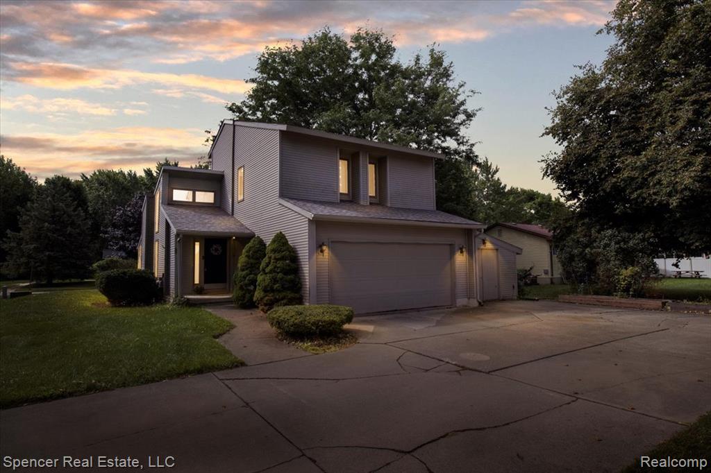 Welcome to this beautifully updated 3-bedroom, 2.5-bath home located in the heart of Davison! This light-filled home features vaulted ceilings, an open-concept layout, and a modern kitchen with stainless steel appliances. The spacious living and dining areas flow into a gorgeous enclosed sunroom—perfect for relaxing year-round. The primary suite includes a remodeled bathroom with stylish finishes. Enjoy entertaining in the finished basement complete with a wet bar, or step outside to a fully fenced yard with an expanded deck. A 2-car attached garage with a 10x20.5 workshop adds valuable space for hobbies or storage. Updates include a newer roof, A/C (2023), and fresh landscaping. Walk to Davison High School, parks, and downtown. No HOA! A must-see property offering space, style, and location.