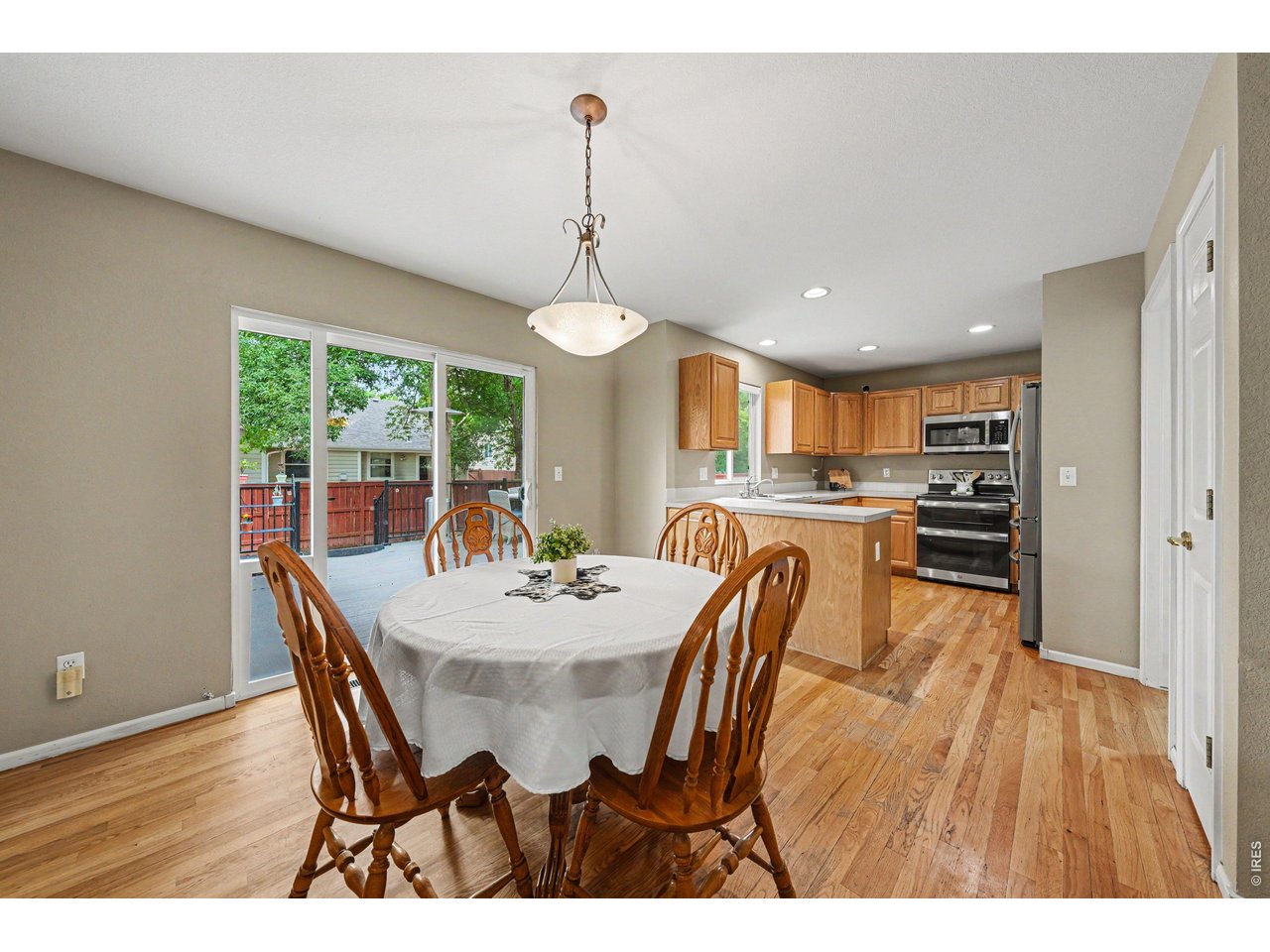 Bright, inviting, and built for easy Colorado living, this southeast Fort Collins home offers spacious living with wired sound system, soaring cathedral ceilings, abundant natural light, and real hardwood floors on the main level. The open layout features a cozy fireplace, an eat-in kitchen with stainless steel appliances, double oven, generous cabinet and counter space, pantry, and a convenient office nook near the entry. Upstairs, the primary suite has northern and eastern views and a luxurious 5-piece ensuite with soaking tub and tile surround, while additional bedrooms offer sunny southern and eastern exposures. The finished basement adds even more living space with new LVP flooring, fresh paint, a rec room, and a private fourth bedroom with ensuite. Outside, enjoy the new composite deck installed in 2024, complete with outdoor TV viewing, a sunshade/privacy screen, and garden bed-perfect for entertaining. With new exterior paint (2025), newer roof (2019 Class IV shingles) a south-facing driveway, a neighborhood park nearby, and easy access to shopping, dining, and the freeway, this home truly has it all. Go ahead- make the move!