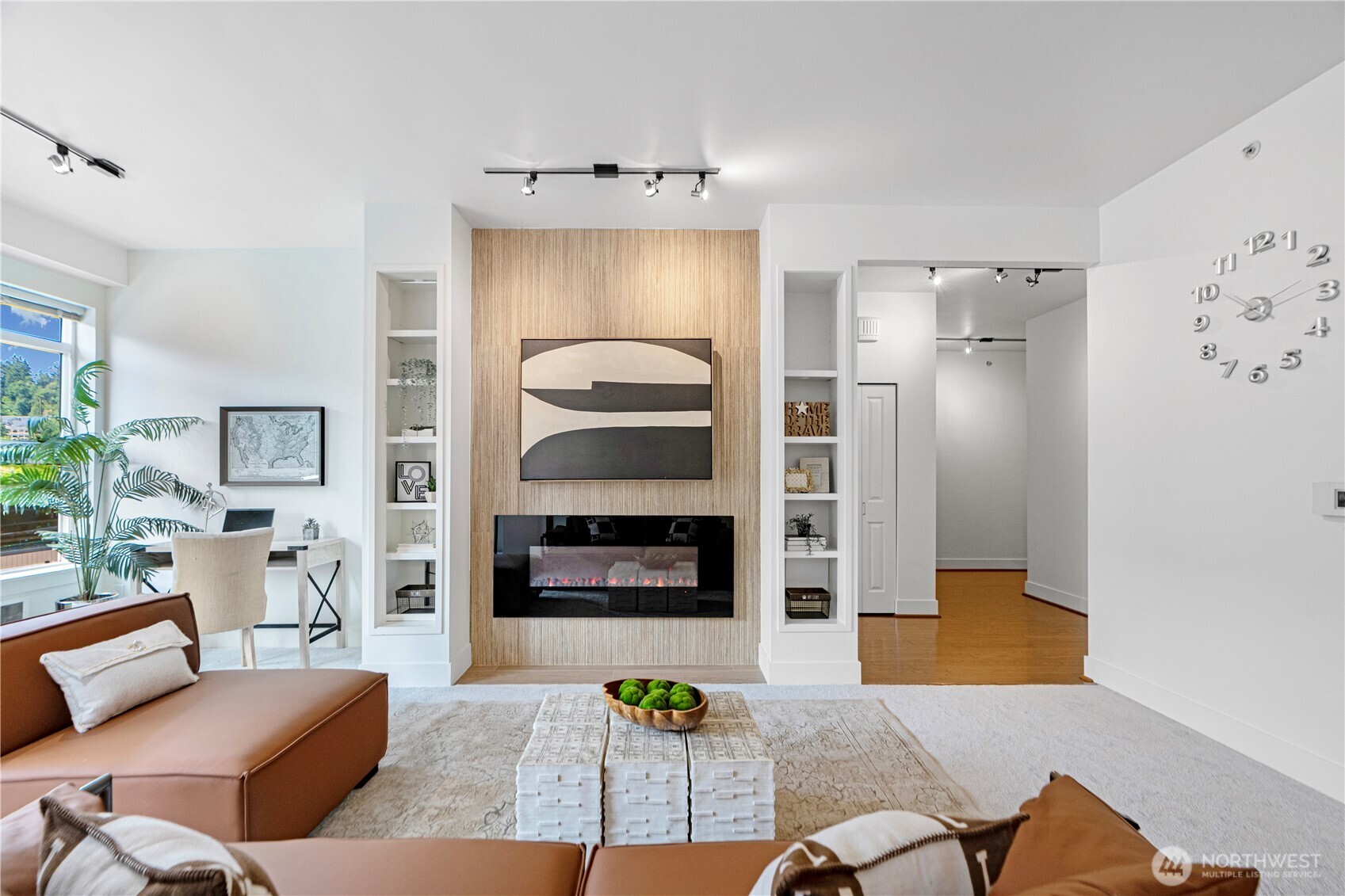 Experience luxurious urban living at 7800 Plaza in Downtown Mercer Island! This tastefully renovated, south-facing, 1498 sqft, 2-bed, 2-bath end unit boasts new paint, carpets & deck surfacing. Chef’s kitchen features custom European Porcelanosa cabinetry, a waterfall ceramic countertop, oversized cast iron sink, and new range hood & dishwasher Enjoy an accent wall with fireplace, gas range, five-piece bath, large walk-in closet with  . 9-foot ceilings w/ abundant natural light, a south-facing balcony, Concrete and steel building provides gated entry, 2 secure garage parking & 1 locker. Conveniently located near Greta Hackett Sculpture Park, light rail station and local shops & restaurants. Pet-friendly, no rental cap. Welcome home.