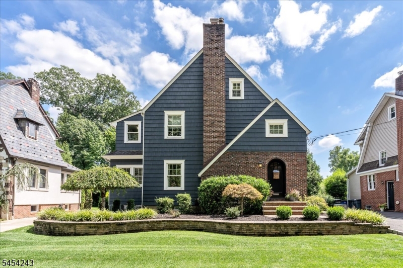 Pride in ownership first comes to mind with this Completely Renovated 4 Bedroom Tudor combining old charm with modern day standards on highly desirable tree lined street just a few blocks from Brookside Place & Cranford High school. The "show stopper" is the Gourmet Kitchen featuring Granite Island, Custom Cabinetry, high end SS appliances, Bev fridge and has a separate dining area to accommodate a large farm table. The Family room w/custom built-ins offers great versatility being wide open to the kitchen and has convenient access to the deck making entertaining a dream. Yes, to a formal Dining room, Living room w/Fireplace, first floor Office, Entrance vestibule, Mud room with double closet/pantry/cubbies and a Powder room to complete the 1st floor. The 2nd level features a Primary suite w/steam shower and an expansive walk in closet, 2 other Bedrooms and a remodeled Hall bath. The walk up 3rd level has a large bedroom & storage room. The basement has been freshly painted w/ epoxy floor ,laundry & there is a 2 car detached garage with loft storage. The well manicured back yard features a trex deck and has mature plantings for privacy and offers easy access to adjoining neighborhood. With features like multi zone Heating & CAC, Anderson windows, wide plank oak HW flooring, security system, recessed lighting, tankless water heater ,water command back up sump pump, outdoor sprinkler system, low voltage lighting and more, it surely doesn't disappoint!