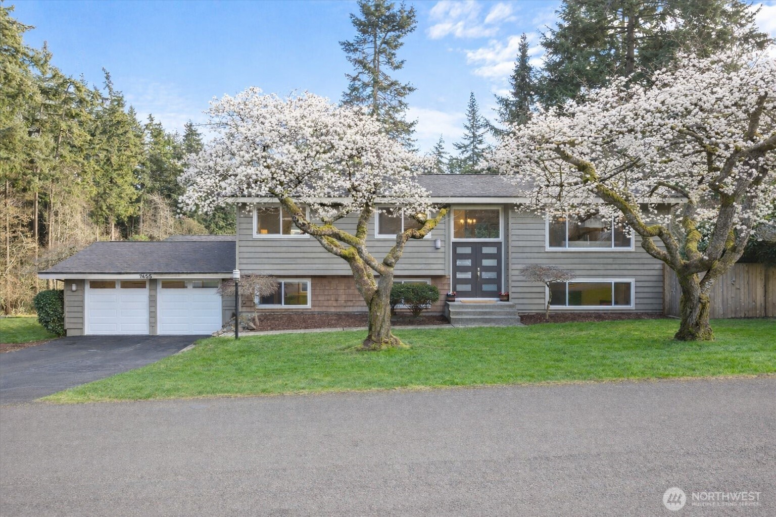 Beautifully remodeled home on large corner lot near Denny Park. Completely dialed & truly turnkey, this extensively updated split-level blends timeless architecture with refined, modern upgrades—each improvement thoughtfully executed with cohesion, quality & longevity in mind. All three bathrooms have been fully remodeled in a sophisticated gray-and-white palette—guest baths with elevated finishes and a stunning primary bath featuring higher-end materials, custom niches & impeccable detail. The kitchen shines with Brazilian granite counters, ss appliances & a generous island with eating bar that opens seamlessly to the inviting living area & beautifully updated fireplace. Rich hardwood flooring runs cohesively throughout both levels, including the office and stairs- risers rebuilt & framing reinforced for a solid, squeak-free feel. Trim inside & out has been meticulously redone with seamless boards and invisible splices. Every outlet and switch has been replaced, with smart switches added for convenience. 2026 Roof. A brand-new furnace enhances comfort & efficiency, along w/added interior wall insulation for sound dampening. The main garage rivals interior space with epoxy floors, heating, new window, WiFi belt-driven openers & matching trim & paint. The powered garden shed mirrors the same quality. Outdoors, enjoy updated decks, fresh fencing, paver walkways, resealed driveways, manicured beds. Expansive shop with strong potential for future DADU conversion. Top Rated LWSD