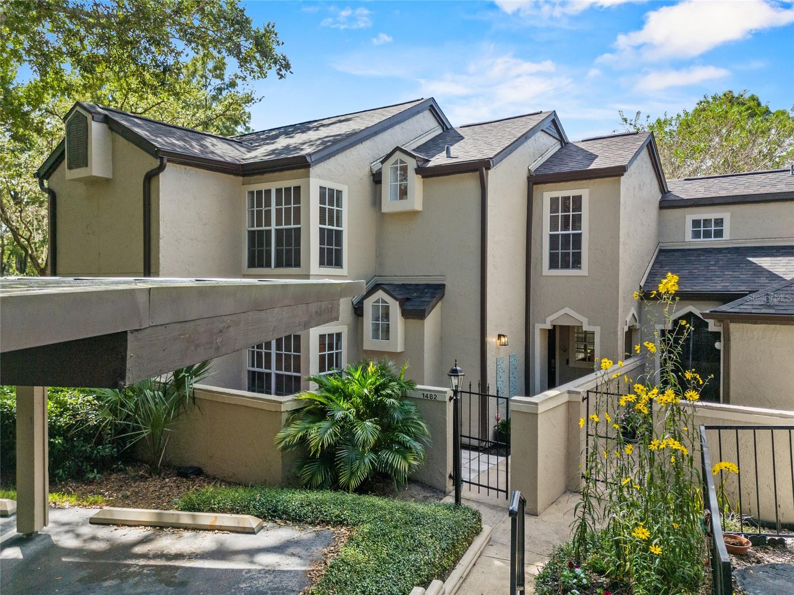 Tucked inside the gated community of Barclay Place at Heathrow, this two-story condo combines comfort, charm, and convenience in one of Lake Mary’s most established neighborhoods. Built in 1989, this 3-bedroom, 2-bath home features vaulted ceilings, a downstairs primary bedroom, an open front patio, a covered back patio, and a wood-burning fireplace that anchors the living space. Recent updates include a brand-new roof, 2023 washer and dryer, a 2022 water heater, new upstairs flooring and plumbing, and an updated kitchen with French doors opening to a private backyard. Barclay Place offers a peaceful setting surrounded by mature trees and thoughtfully maintained landscaping. Residents enjoy access to a sparkling community pool and spa, tennis courts, a clubhouse for gatherings, and convenient covered parking. The Seminole Wekiva Trail is nearby for morning walks or bike rides, and the community is just minutes from shopping, dining, and major highways, making daily life feel balanced and connected. With its blend of timeless character and practical upgrades, this home sits in one of Lake Mary’s best kept secrets.