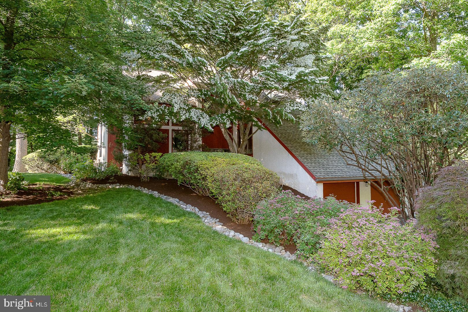 Designed in the signature contemporary style of Chip Vaughan, 2101 Quail Ridge Drive is an architecturally distinctive Paoli residence where privacy, natural light, and wooded surroundings come together beautifully. Set on nearly an acre in one of the area’s most desirable locations, the home offers over 3,382 square feet of living space with soaring ceilings, walls of glass, and a unique multi-level design that creates a sense of openness while still offering defined spaces for everyday living, entertaining, working, and relaxing.The updated primary suite serves as a private retreat, while the finished lower level adds valuable flexibility for recreation, guests, fitness, or a dedicated work-from-home space. Throughout the home, expansive windows frame the mature landscape and bring the outdoors into daily view, creating a calm and highly private setting rarely found so close to the conveniences of Paoli and the Main Line.The outdoor living is equally compelling. An expansive IPE hardwood deck extends the living space into the surrounding landscape, offering a natural setting for dining, entertaining, or simply enjoying the wooded backdrop. Mature plantings enhance the sense of privacy and make the property feel removed, while still being minutes from major transportation routes, shopping, dining, and the award-winning Tredyffrin-Easttown School District.Extensive updates provide confidence and comfort, including a new furnace, new central air, full duct replacement, newer roof, updated 200-amp electrical service, Bryant whole-house dehumidifier, hot water heater, laundry appliances, LeafGuard gutters, and Andersen windows.Distinctive, private, and architecturally significant, 2101 Quail Ridge Drive is a rare opportunity to own a home that feels connected to nature, is designed with intention, and truly unlike the ordinary.  Schedule your private showing and see what makes 2101 Quail Ridge Drive a true standout.