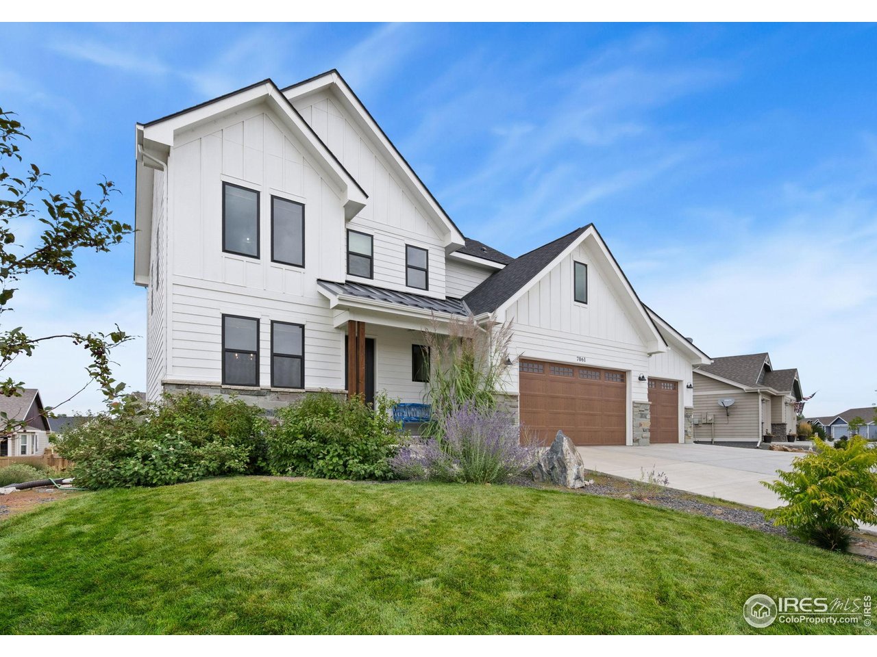 Kittle Real Estate presents this single-owner, custom-built home in Sage Meadows blends exceptional care, thoughtful design, and high-quality upgrades into one inviting package! Significant improvements were made after purchase, including a finished basement and professional landscaping with a full sprinkler system, making the home feel better-than-new and move-in ready. Inside, the home's modern farmhouse design shines through with 9-foot ceilings, top-of-the-line LVT flooring on all three levels, and sleek black clad windows and patio door. The main living area features a gas fireplace and an easy flow into the kitchen and dining spaces, creating a perfect setting for everyday living and entertaining. The kitchen features stainless steel appliances, expanded cabinetry, quartz countertops, and a pantry to keep your cooking essentials organized. The separate dining area can also double as a secondary living space, depending on your needs. A dedicated office with a built-in hickory desktop provides the perfect workspace. The upper level features a spacious primary suite with tray ceilings, a luxurious 5-piece ensuite bath, and a walk-in closet. Two additional bedrooms share a Jack-and-Jill full bath, adding both privacy and convenience. The garden-level basement adds even more living space with an entertainment area, a fourth bedroom, a full bath, and additional storage space. Outside, the backyard includes a raised deck for outdoor gatherings and relaxation. Irrigation water is included with the HOA, keeping your lawn looking great all season long. The insulated 3-car garage offers plenty of room for cars, tools, and recreational gear. Enjoy community perks with access to an outdoor pool and park, right in the neighborhood. Located west of I-25, making trips to Fort Collins, Old Town & CSU a breeze. Additional highlights include a Class 4 impact-resistant roof, tankless water heater w/ circulation line, water softener & whole-house water filter.