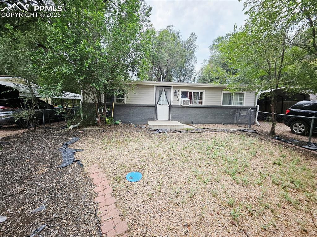 Move-in ready 3-bed, 1-bath ranch in sought-after Stratmoor Valley. Bright living room with large view window, updated kitchen with vinyl plank flooring, corner island and stone-style counters. Brand new water heater. Includes enclosed sunroom, main-level laundry, mature trees, fenced backyard with shed, RV access and carport. No HOA. Convenient to parks, schools, Fort Carson, Peterson SFB and I-25. Interior will be painted and carpets cleaned, before day of closing. Selling AS IS seller does not have funds for any repairs. Seller is a licensed real estate agent.