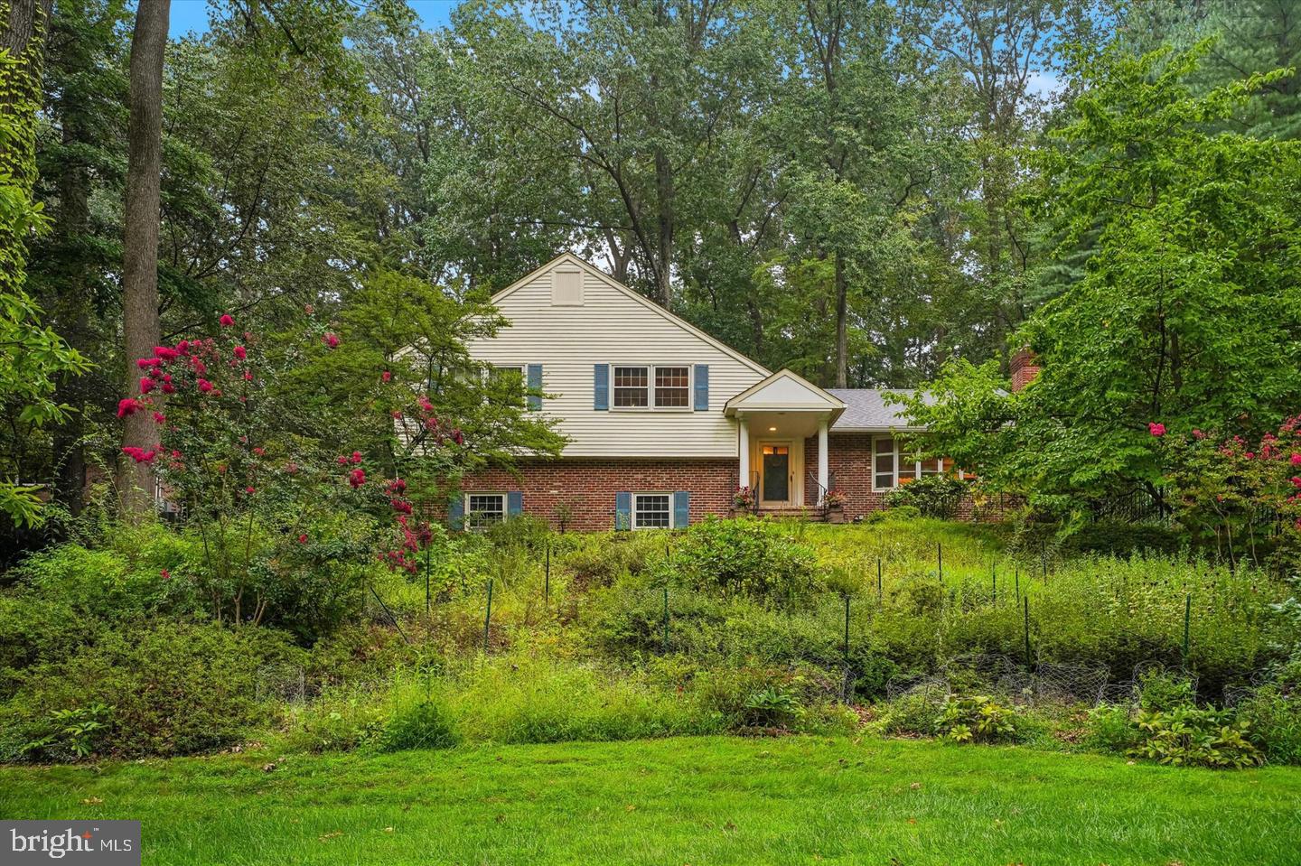 Beautifully refreshed and professionally staged, this distinctive four-bedroom, three-full-bath home sits on a private, wooded .74-acre property in Tredyffrin Township's desirable Woodlea neighborhood. Lovingly maintained by the same owner for more than 21 years, the home combines timeless character, substantial recent improvements, and extraordinary gardens.Recent enhancements include fresh paint throughout, new carpeting in several rooms, a completely replaced electrical service line and panel, electrical and lighting improvements, and new exterior LED lighting. The home has been converted to natural gas heating, features three-zone climate control and a generator serving most of the house, and has a brand-new central air conditioning system scheduled for installation.Inside, hardwood floors, crown molding, and generous living spaces create an inviting atmosphere. The versatile lower-level family room, previously used as a bedroom, features radiant-floor heating, a full bathroom, and a beautiful picture window overlooking the gardens. Additional improvements include freshly painted garage and basement floors and basement walls treated with waterproofing paint.The grounds are truly special. Nearly 100 varieties of flowers and plants, cultivated over two decades, create a secluded garden retreat offering changing colors and beauty throughout the seasons.The kitchen and select bathrooms offer the opportunity for personal updates, while the home's spacious layout, thoughtful features, and completed improvements provide an appealing foundation.Located in the Tredyffrin-Easttown School District, less than a mile from Conestoga High School, with convenient access to Valley Forge National Historical Park, Gateway Shopping Center, major highways, and the Main Line.A home with character, beautiful grounds, and a fresh new presentation, ready for its next chapter.