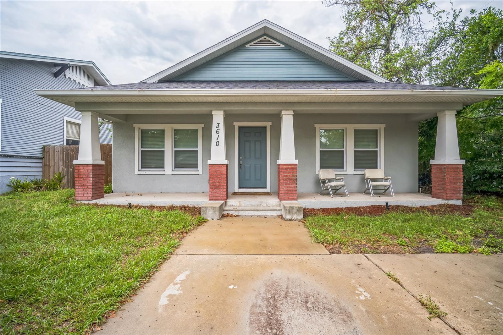 Beautifully updated home in the heart of Tampa! This property features an open-concept layout with modern finishes throughout. The spacious kitchen offers white cabinetry, stainless steel appliances, and a large island perfect for entertaining. Step outside to your private, fully fenced backyard with low-maintenance turf and a cozy wood deck — ideal for relaxing or hosting BBQs. Tile floors run throughout the main living areas for a sleek, clean look. Centrally located near shops, dining, and quick access to major highways. Perfect for first-time buyers, downsizers, or investors. No HOA!