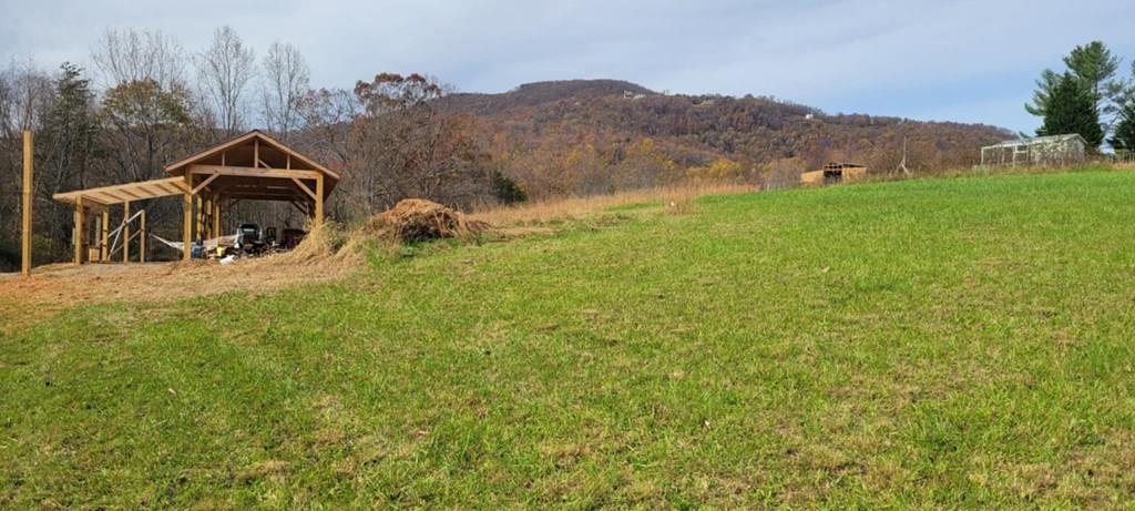 6.335 +/- acres just minutes from the parkway. **Perc Test Approved. Permit for Perc and Well are out of date. Come see this amazing off grid property. This property features walking trails, creek, pole barn, off grid cabin, gated entrance and views of the parkway. Restriction against commercial chicken houses.