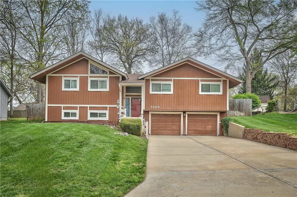 This 3-bedroom, 4-bathroom home in Raytown offers a unique blend of character, space, and functionality with a layout that stands out from the typical cookie-cutter design. From the moment you arrive, you’ll notice the inviting curb appeal, spacious driveway, and attached two-car garage.Inside, the home opens up to a bright and airy main living area featuring vaulted ceilings, warm wood accents, and a striking fireplace that anchors the space. Large windows and sliding glass doors bring in natural light and create an easy connection to the backyard, making the main level feel open and welcoming.The kitchen offers plenty of cabinet storage, generous counter space, and a functional layout that flows seamlessly into the dining area—ideal for everyday living or hosting guests. Just off the main living space, you’ll find well-sized bedrooms, including a primary suite setup, along with multiple bathrooms that provide flexibility and convenience for a variety of living situations.Downstairs, the home continues to deliver with additional living space perfect for a second family room, recreation area, or home office setup. With four bathrooms total, there’s no shortage of functionality throughout the home.Step outside to a fenced backyard with room to relax, entertain, or make your own outdoor vision come to life.If you’re looking for a home with solid bones, distinctive style, and room to personalize, this Raytown property is one worth seeing in person.