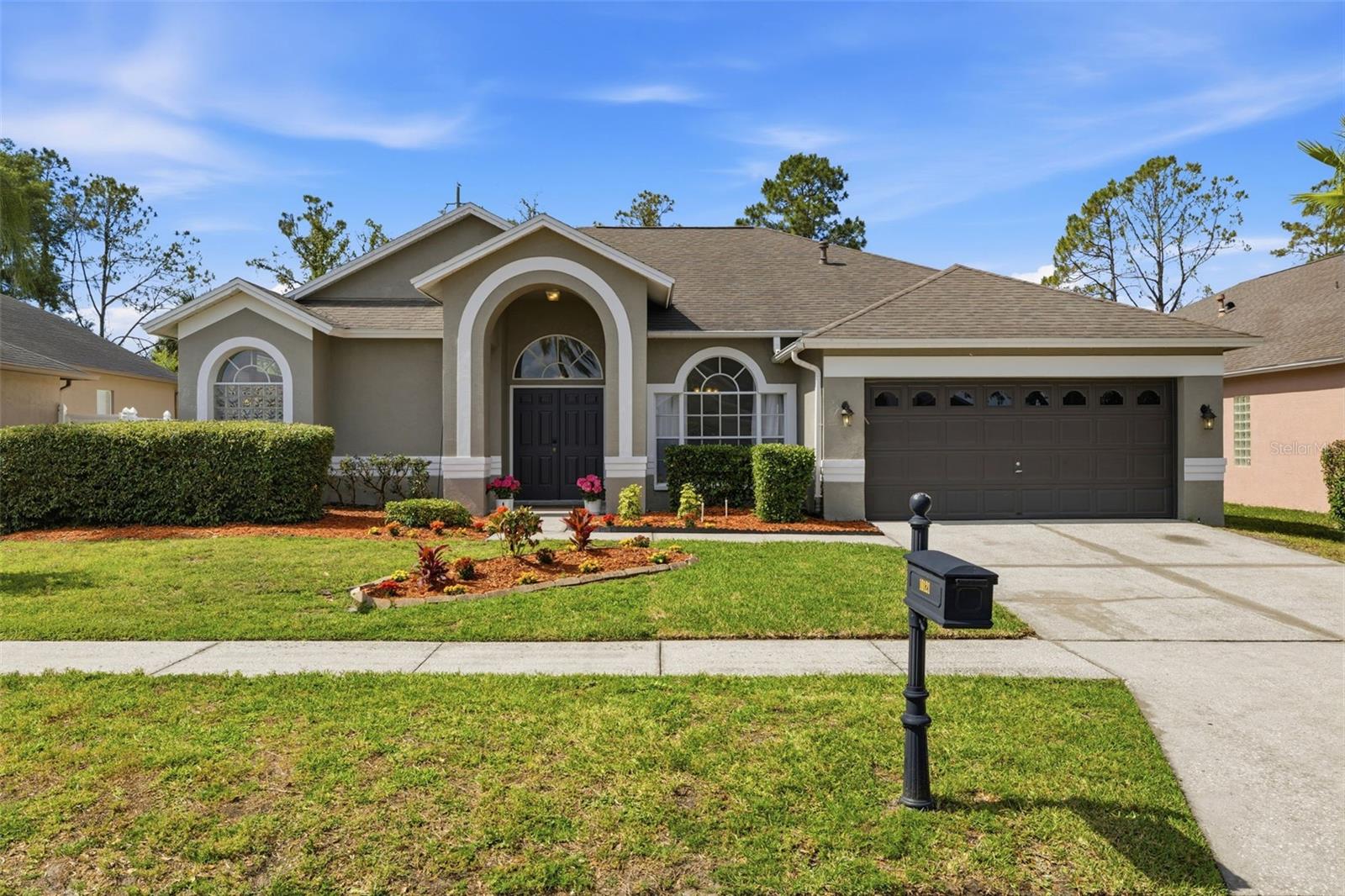 Welcome to this well-maintained, move-in ready home in the highly desirable gated Kingshyre community, ideally located on a quiet interior street with no rear neighbors. Backing to open green space, this home offers a rare sense of privacy while still being close to everything New Tampa has to offer.Inside, you’ll find a functional and comfortable layout with multiple living areas, highlighted by tall ceilings and abundant natural light that create an open, airy feel throughout. The kitchen flows naturally into the main living spaces, making it ideal for everyday living, entertaining, or working from home.The primary suite offers a private retreat with generous space, while the additional bedrooms are well-sized for family, guests, or a home office. Step outside to a covered patio, perfect for relaxing evenings or weekend gatherings, all while enjoying the added privacy of no direct rear neighbors.Located in Flood Zone X where NO FLOOD INSURANCE is required, this home also features NO CDD and a LOW HOA, helping keep monthly costs more affordable. Clean, well-kept, and truly move-in ready, this is a great opportunity to get into one of New Tampa’s most desirable gated communities.