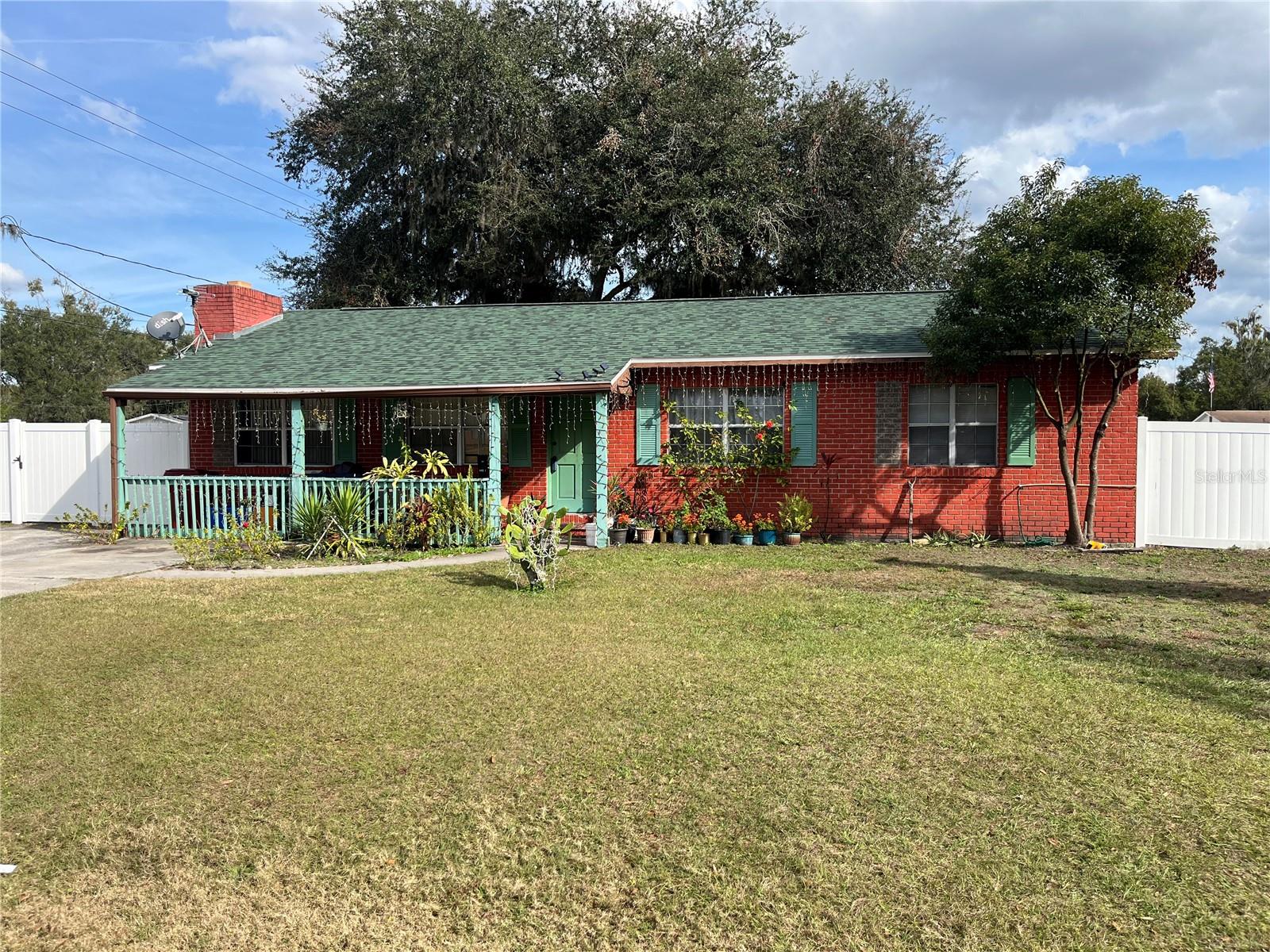 Welcome to 1506 N Bracewell Street in Plant City, conveniently located near downtown, shopping, and with easy access to I-4—perfectly situated between Tampa and Orlando. This well-maintained brick-exterior home offers 5 bedrooms, 2 bathrooms, 1 bonus flex room, and approximately 2,150 heated square feet of living space.The home features a new roof and new water heater, both installed in 2025, providing peace of mind for the next owner. Inside, you’ll find tile flooring throughout, granite countertops in the kitchen, and a cozy fireplace anchoring the living room. An enclosed bonus room in the rear corner of the home offers additional flexible space.Outside, enjoy a charming front porch ideal for relaxing, a fully fenced backyard with vinyl fencing, and a storage shed that conveys with the property. With its central location, functional layout, and recent updates, this home offers both comfort and convenience.