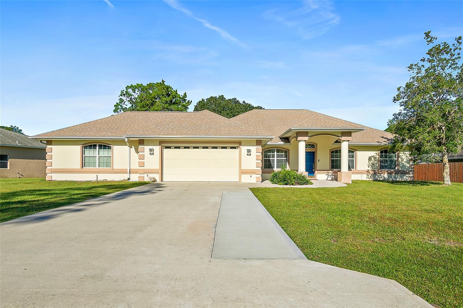 A rare find in the highly sought-after Pine Lakes neighborhood of Palm Coast. This property offers an expansive oversized lot containing over a half an acre paired with an extended garage / dedicated workshop space. This property offers an oversized backyard and privacy while remaining close to local town amenities and the Pine Lakes Public Golf Course. The concrete block and stucco home features 2,581 square feet of living space and is comprised of a split floor plan including three bedrooms, two full bathrooms in the main living area, a front office space, and a formal dining room. The main living room flows seamlessly into an enclosed Florida room at the rear of the home, providing a relaxing area to enjoy the large backyard and views. Car enthusiasts, hobbyists, and those needing extra utility or storage space will appreciate the exceptional garage setup. The property has a two-car attached garage plus an additional two-car garage/workshop. This dedicated workshop area includes a convenient half bathroom and a rear-facing garage door that leads into the backyard area. A separate detached shed in the yard provides more outdoor storage. Recent updates include a new HVAC system installed in 2026 and a new roof in 2021. With its combination of over a half an acre lot, solid quality of construction, and extended garage setup, this property offers great versatility and is a rare find for the market area.