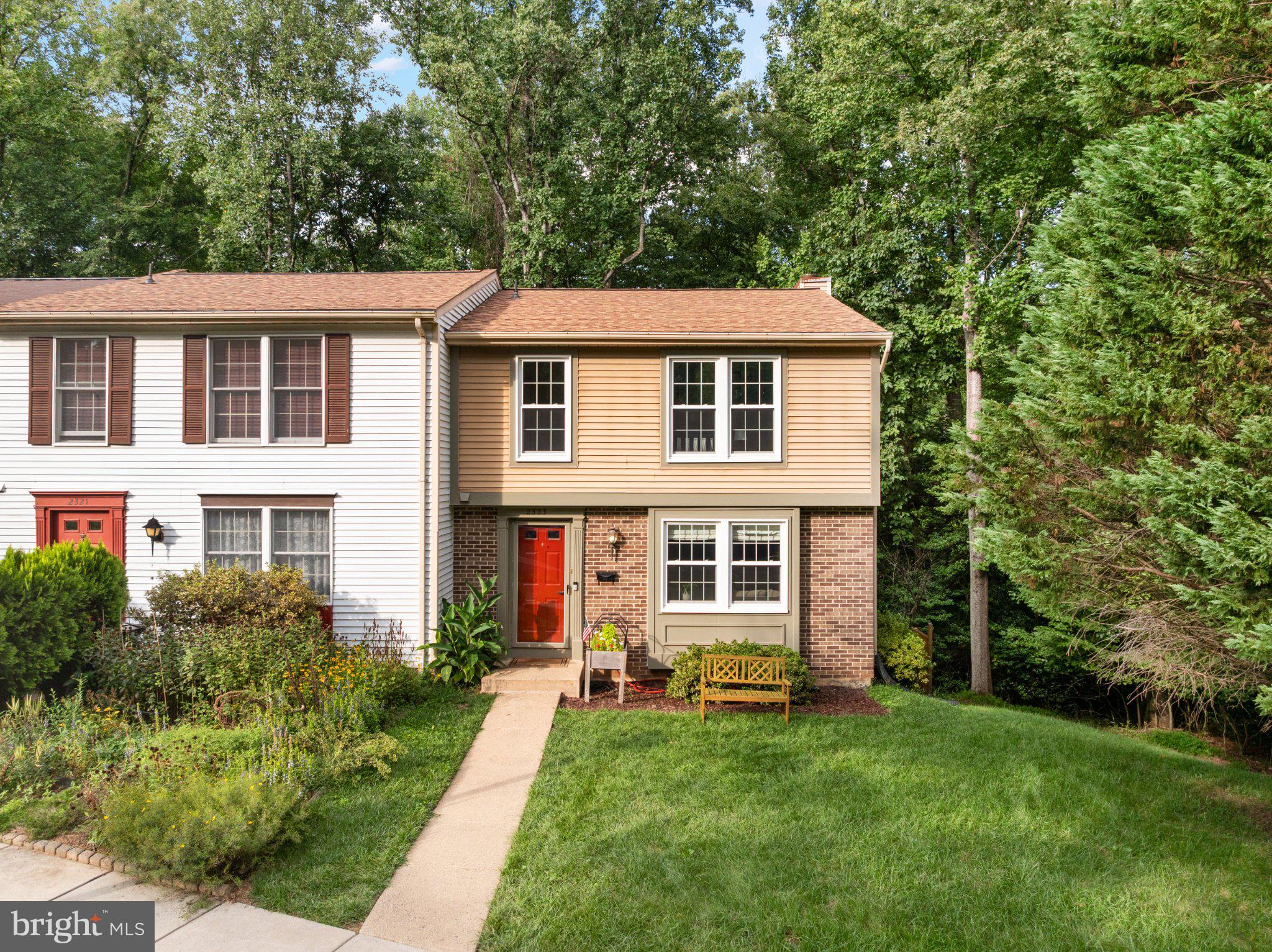 The epitome of Reston living – an updated END-UNIT townhouse nestled in a quiet enclave of townhomes, backing to trees and trails yet minutes from amenities, shopping, Metro and major roads! 2323 Middle Creek offers 3 finished levels of thoughtful upgrades, including fresh paint and new carpet in 2025 and a RENOVATED PRIMARY BATH & closet less than a year ago! Roof installed in 2020 – newer windows as well! Hardwood floors run from the expansive living room with box bay window into the separate dining room. The kitchen features stainless steel appliances, granite countertops, and ample storage/prep areas. Upstairs all 3 bedrooms have lighted ceiling fans. The recently remodeled primary bathroom boasts 12x24 tile, stall shower and new vanity with backsplash (offering utility and visual appeal!).  The full hall bathroom is updated as well, with sleek vanity, tiled floor and tub shower with eye-catching hexagon wall tile. The WALK-OUT basement is home to spacious recreation room as well as a cozy bonus room/den with built-ins – a flexible space that would make a for a great office or homework station. Conveniently positioned powder rooms on both the main and lower level. Grilling and firepit season is far from over, and the large rear deck, overlooking lush parkland, is perfect for both! TWO ASSIGNED PARKING SPOTS! Residents of the Hamlet Cluster enjoy picturesque streets surrounded by parkland, and a monthly HOA fee that includes trash and snow removal as well as front yard mowing! A nearby footpath runs to the Snakeden Branch Trail, connecting to the larger network of Reston pathways beyond. Enjoy access to the dazzling array of amenities (lakes, pools, tennis and pickleball courts, tot lots and more) that comes with membership in the Reston Association.  UNBEATABLE LOCATION – commuters will appreciate proximity major routes of transportation, a metro station 2.5 miles away and a local bus stop at the top of the street. You’ll love the convenience to the shopping, dining and entertainment at Reston Town Center! Closer to home, the Walker Nature Center, Glade Pool and Tennis Courts, the Reston Community Center, and Hunters Woods Village Shopping Center are all within 1 mile.