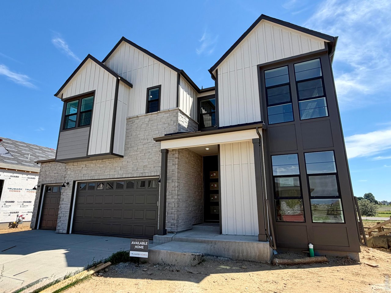 Welcome to this Trumark Homes Plan 4 at 1284 Weller Street at Kitchel Lake 49. A beautifully designed home with approximately 2,968 sq. ft. of finished living space and thoughtfully selected designer finishes throughout. The spacious layout offers an inviting atmosphere for everyday living and entertaining, while the Diana Two package showcases white cabinetry and matte black hardware for a timeless, contemporary look. A 20 ft. tall floor to ceiling tiled fireplace adds warmth and character to the main living area, while the elegant primary bath features a freestanding tub for a spa-like retreat.Additional highlights include a garden-level homesite and an unfinished basement, providing added flexibility and storage. With generous living spaces and designer-selected finishes, this home offers the perfect blend of comfort and style. Ask about our special builder lending incentives - this home will cost less per month than you think!