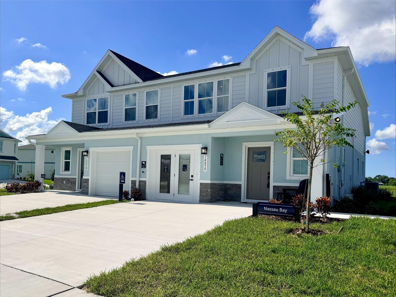 Main floor owner's suite! Move in Ready! End Unit! Welcome to Emerald Fields, a new home community bringing exceptional value, modern living, family-friendly amenities, and no CDD fees to Hudson, Florida. Discover the Nassau Bay, a thoughtfully designed villa created for homeowners ready to simplify without sacrificing comfort. Featuring a desirable first-floor owner's suite, open-concept living spaces, modern finishes, and room for visiting family and friends, the Nassau Bay offers the right amount of space for your next chapter. Select homesites also offer beautiful pond or conservation views, providing a peaceful backdrop to everyday living. Two additional bedrooms are the perfect space for a growing family, office space or visiting guests. All Ryan Homes now include WIFI-enabled garage opener and Ecobee thermostat. **Closing cost assistance is available with use of Builder’s affiliated lender**. DISCLAIMER: Prices, financing, promotion, and offers subject to change without notice. Offer valid on new sales only. See Community Sales and Marketing Representative for details. Promotions cannot be combined with any other offer. All uploaded photos are stock photos of this floor plan.