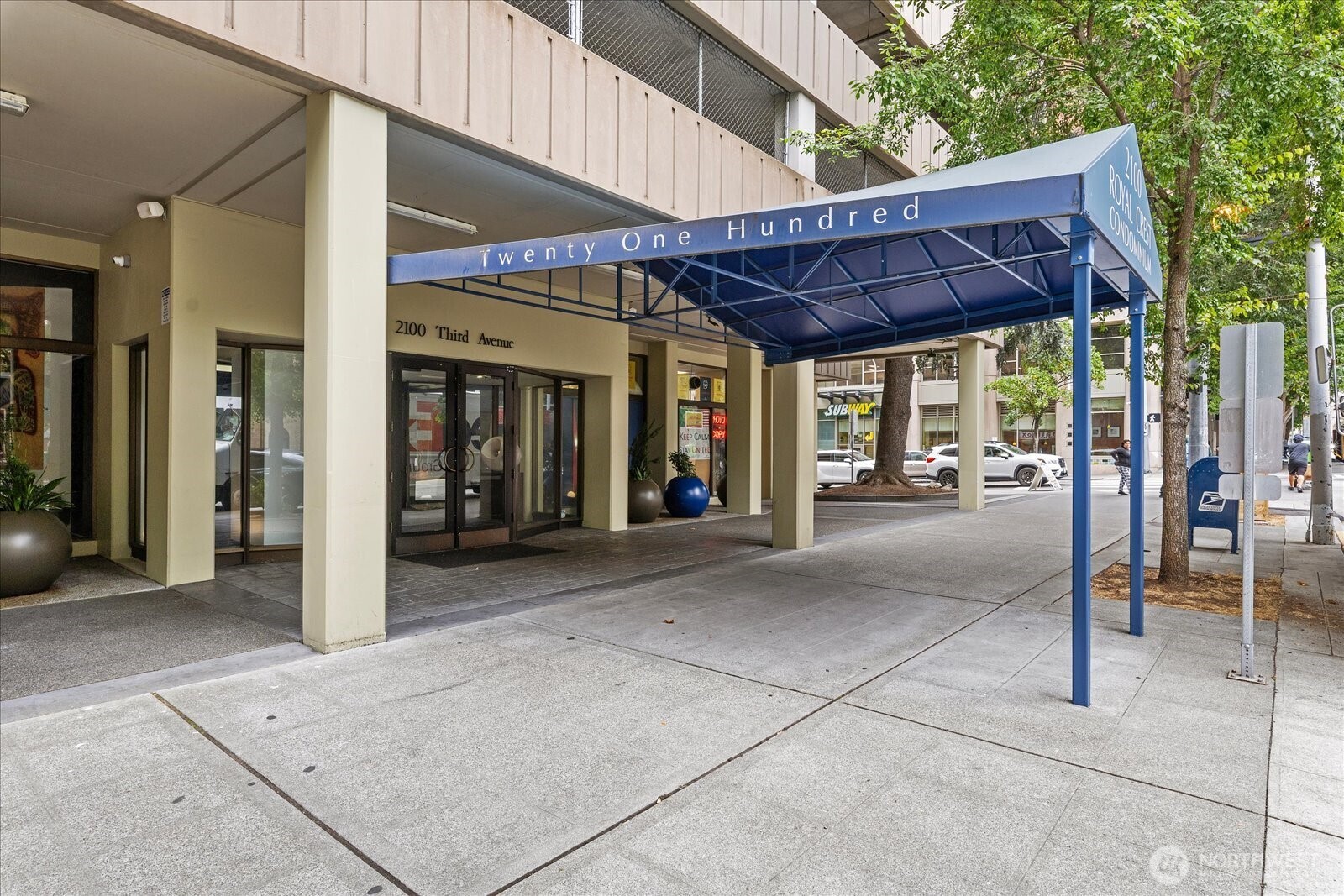 Large windows showcase the views of Elliott Bay, the Olympic Mountains, and the Space Needle from this 2-bedroom, 1.75-bath corner unit located in the heart of Seattle. Covered balcony allows enjoyment for all seasons with breathtaking water and cityscape views. The newly  renovated kitchen with modern finishes, while both bathrooms have been thoughtfully updated with new tile and fixtures. The spacious primary suite offers sweeping NW views, en suite bathroom and walk-in closet. A versatile second bedroom enjoys captivating views—ideal for guests, a home office, or creative space. Fresh interior paint and custom built-ins add warmth and functionality throughout. Exceptional building amenities include an outdoor pool, fitness center with sauna, community room & kitchen, BBQ area, Amazon lockers, on-site manager, and more. Secured garage parking stall #27. Storage Unit #42.  HOA dues cover all utilities + earthquake insurance.  Location is just steps from Pike Place Market, Amazon HQ, dining, shopping, waterfront attractions, and major transit options. Pool and party room located on 4th floor.