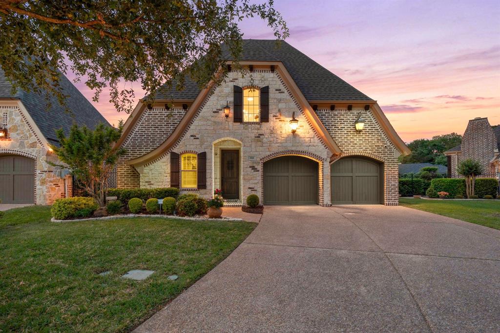 Single-story home with standout curb appeal and beautifully landscaped, low-maintenance grounds. Located in the desirable Cambridge Place neighborhood, the HOA includes front yard edging and mowing for easy upkeep. Inside, custom built-ins line the entry hallway, leading to a private office with elegant French doors. The open-concept floorplan features a spacious living room with a cozy gas fireplace and a wall of windows that fill the space with natural light and overlook the inviting patio. The primary suite is a true retreat, complete with a generous seating area, its own fireplace, and direct patio access. The ensuite bath offers a relaxing garden tub, a walk-in shower with bench seating, and a large walk-in closet. Enjoy a beautifully designed outdoor space with a patio, retractable awning, lush landscaping, and maintenance-free turf—perfect for relaxing or entertaining year-round. Conveniently located between Dallas and Fort Worth, minutes from the Dallas Fort Worth International Airport. Nearby Southlake Town Square and Historic Downtown Grapevine offer endless dining and shopping options!