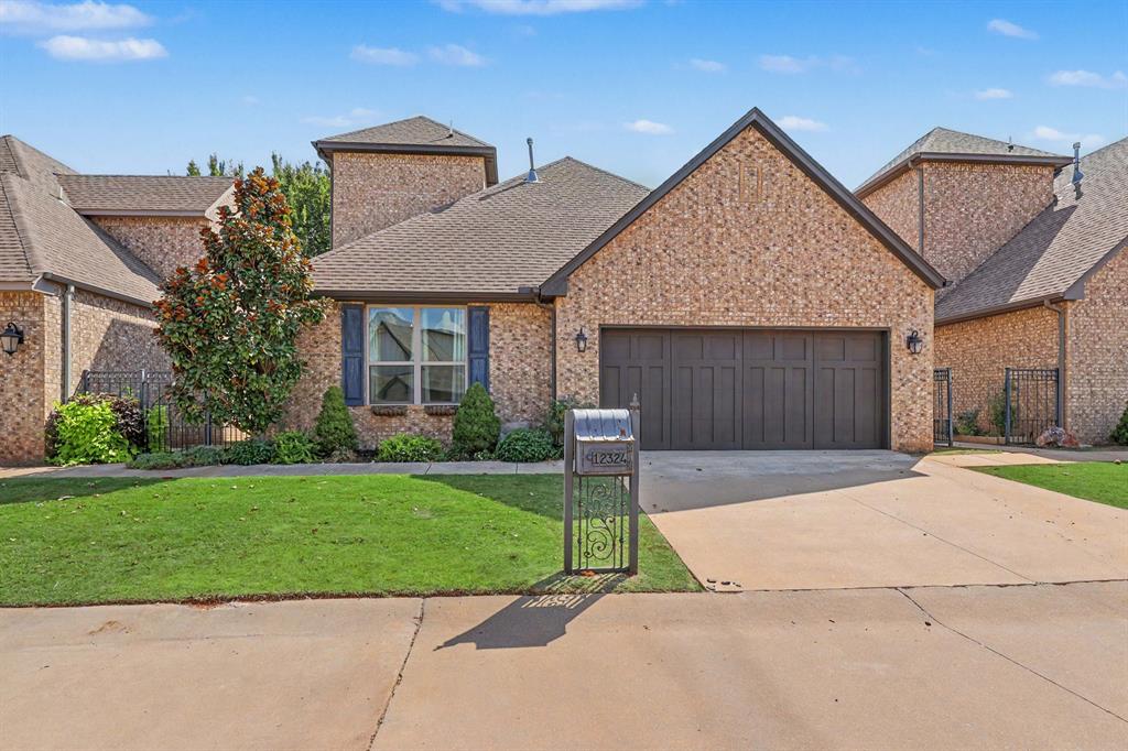 Welcome to this beautifully maintained home in the gated Hidden Forest Addition, quietly tucked away on a private cul-de-sac in North Oklahoma City. A charming private courtyard welcomes you into this inviting home, which offers a spacious, open-concept layout designed for comfortable living and entertaining. The main living area features large windows that fill the space with natural light, a cozy fireplace, and an easy flow into the kitchen and dining areas. The kitchen offers ample counter space, granite countertops, ceramic tile flooring, and beautiful appliances.The spacious downstairs primary suite features a tray ceiling, private bathroom, and walk-in closet. Two additional bedrooms offer generous space.  Enjoy the convenience of low-maintenance living with plenty of parking for guests. Ideally located just minutes from the Turner Turnpike, shopping, restaurants, and hospitals, including Mercy Hospital, while still offering the privacy and tranquility of a gated, one-street community. This North Oklahoma City gem offers the perfect combination of comfort, convenience, and privacy. Come see it today!