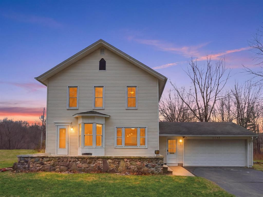 Distinguished historic farmhouse gracefully set on 4+ secluded acres bordering Waterloo Recreation Area, offering a rare blend of privacy, natural beauty, and refined country living within Chelsea Schools. Thoughtfully curated updates include new paint, newer carpeting, and energy-efficient windows, compliment the home's timeless architecture. A flowing open concept design reveals an inviting living room and a well appointed kitchen with stainless steel appliances, abundant cabinetry, and effortless functionality. The main-level primary suite provides a walk-in closet and full bath. Upstairs, a private secondary suite with tiled bath is accompanied by two additional bedrooms. A generous dining and family room addition enhances both scale and comfort. The grounds are equally captivating, with a tree-lined backdrop and direct state land frontage ensuring lasting tranquility. Complete with a classic four-stall barn, additional outbuilding, and attached 2.5-car garage.New Septic Tanks in 2021, New Well 2023, easement noted on sellers disclosure if for utilities (DTE). Roof is estimated to be about 12 years old.