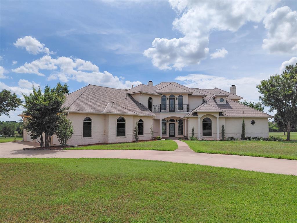 This gorgeous property sitting on 3.2 acres of waterfront catches your attention the minute you pull up. The spacious kitchen hosts double ovens, center island and veggie sink, pantry and built in organizer. The laundry room offers a hand washing sink, tones of linen storage, and space for secondary fridge. The bath of the kitchen doubles as a safe room. The spacious living room is complete with cathedral ceiling built ins, and double sided fireplace to formal dining. Two guest rooms are large in size with full baths.  Gorgeous study!  The wet bar is complete with a sink and fridge area. The primary bedroom has views of the lake, and the bath has a walk in shower, his and her closets and large corner jacuzzi tub. Oversized garage spacious enough for a boat! You will love the outdoor patio, scenic waterfront view and INGROUND POOL!