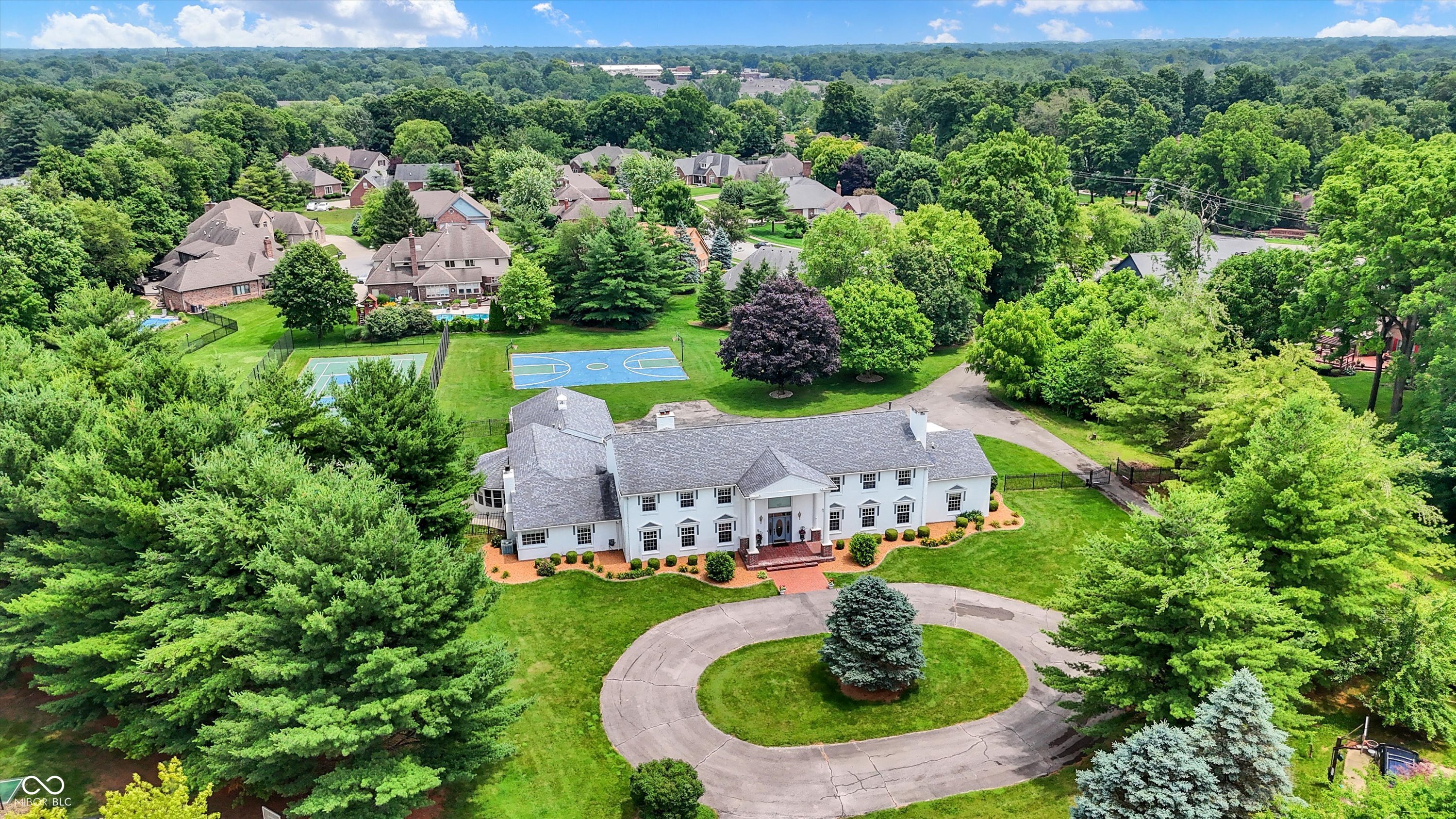 Here is your chance to live in the White House!  This incredible 9,600 sq ft home has all the amenities that make everyday feel like a getaway.  This Property Sits on nearly 3 Acres, with room to add a barn or guest home.   With 4 bedrooms and 8 bathrooms, there's room for everyone to spread out and enjoy. The main level features a formal dining room for special occasions, an eat-in kitchen, a study that could be converted back into a primary bedroom suite, multiple living spaces including a formal living room, a spacious great room, huge sunroom, and laundry for the pool towels.  Upstairs offers 4 bedrooms, 4 full baths, game room, and laundry room.   A fully finished basement is ready for game days, dancing, exercising, and full bar for entertaining.  Step out back and you'll find the true showstopper-an in-ground pool with a slide, your own tennis court, and a full basketball court, and additional ground to build an in-law quarters, shed, and more!  Whether you're hosting a party or just enjoying a quiet evening, this home was built for both entertaining and relaxing.    Tour this unique gem today.