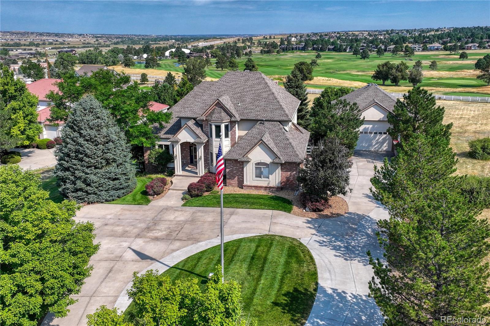 Open House May 6th. Experience luxury living in the prestigious High Prairie Farms community with this beautifully updated 4-bedroom, 5-bathroom home set on 2.4 private acres. Surrounded by breathtaking views of the golf course, mountains, and valley, this property offers the perfect blend of elegance, comfort, and Colorado lifestyle.The heart of the home has been completely modernized with top-of-the-line Signature Kitchen Suite (SKS) appliances, including a 48-inch pro range with chrome griddle & steam oven, built-in refrigerator, and beverage coolers. Thoughtfully designed indoor and outdoor spaces create seamless living and entertaining opportunities while capturing the spectacular scenery from nearly every angle.Step outside to the expansive deck, the perfect setting for morning coffee, evening relaxation, or gathering with family and friends while enjoying the panoramic views. With 2.4 acres, you'll appreciate the privacy, open space, & freedom that are increasingly difficult to find.The walkout lower level is designed for recreation and entertainment, featuring a billiards area, TV and recreation room, a second office, and additional space for games and hobbies. Upstairs, the luxurious primary suite offers a five-piece bath and dual walk-in closets. A private guest suite includes its own ensuite bath, while two additional bedrooms share a convenient Jack-and-Jill bathroom.Car enthusiasts, hobbyists, and RV owners will appreciate the oversized 4-car garage with hot and cold water service. A standout feature of the property is the impressive 40' x 32' heated and finished outbuilding, complete with its own side-access door. Ideal for RV storage, a workshop, recreational vehicles, or a dream hobby space, this versatile building is a rare amenity that many buyers will find invaluable.This exceptional property combines luxury updates, stunning views, generous acreage, and highly sought-after accessory space in one of the most desirable neighborhoods.