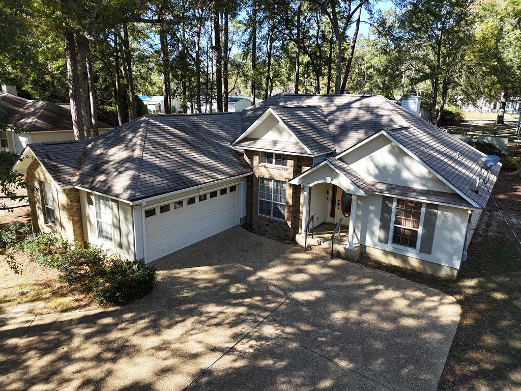 If it's FALL VIBES you are looking for, look no further than this beautiful home at 114 Eagles Landing, Thomasville, GA! This amazing 3BR/2Bath home has been lived in, lovingly taken care of, and now looking for new residents. The wide open living room features a great fireplace, HUGE windows for lots of natural light, and the perfect nook for morning coffee or late afternoon puzzles & board games. The large primary suite has a big picture window and great luxury bathroom with dual sinks and a nice big closet. Two cozy guest rooms at the other end of the house share the 2nd bathroom, and there is also a nice 2-car garage for your vehicles and storage. Out back you will find a nice patio and a wonderful screened outbuilding you can use for a cooking shack, she-shed, and MORE!! For more information on this wonderful home, call your favorite Realtor TODAY!