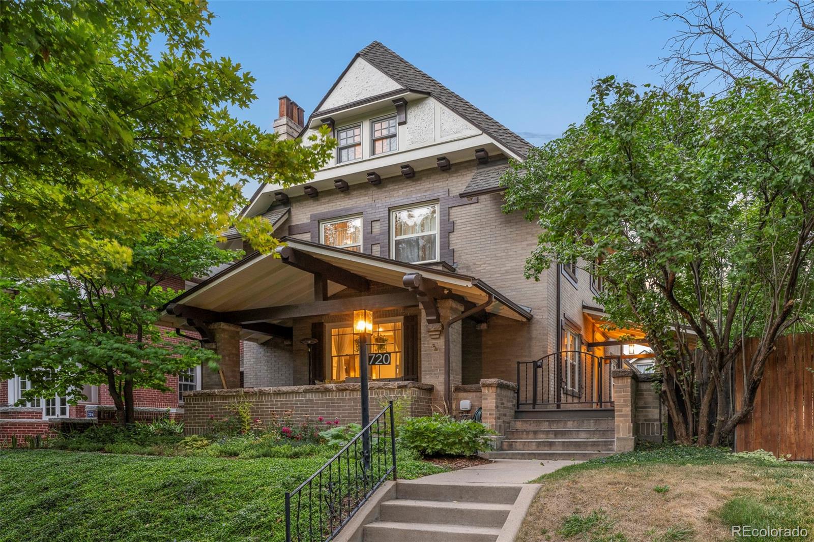 Built in 1915, this home located in the 7th Avenue Historic District is a perfect blend of historic detail and tasteful updates. Thoughtfully restored to retain its vintage character while updating it for contemporary living.

Original features abound, including a living room with a fireplace and coffered ceiling, original glass pocket doors lead to the dining room, and intricate woodwork has been lovingly refurbished.

The functional layout creates ample space for entertaining both indoors and outdoors.

The main floor sprawls with a comfortable living room overlooking the charming covered front porch. A formal dining room adjoins both the chef’s kitchen and living spaces. The kitchen is a dream with tons of storage and counter space + a breakfast bar for informal dining. The sun-filled and spacious sitting room opens beautifully to the back and side yards and the numerous sitting/entertaining spaces.

The second floor offers a primary suite with an updated bathroom, plus 2 additional bedrooms and a shared hall bathroom with a dual vanity. There is a bonus room connecting the secondary bedrooms - offering a flex space for an office, or play/tv room. On the third floor, with high ceilings, there are two bedrooms and a full bathroom.

The basement is well laid out with a bedroom or rec room, bathroom and a laundry room – plus additional storage throughout.

Enjoy the Colorado climate from multiple outdoor spaces, including the welcoming covered front patio and a deck that wraps around the sunny south and west sides of the house. The xeriscaped yard is very low maintenance and sets the perfect backdrop for hosting.

The location is hard to be beaten - less than a block from Cheesman Park and the Denver Botanic Gardens. You're also a short distance from local favorites like Satchel's on 6th, Oliver's Market, and Novo Coffee, with easy access to Cherry Creek North and downtown.