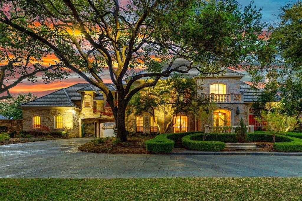 This luxurious 0.731-acre estate in exclusive Willow Bend Country stands out for its exceptional craftsmanship & bespoke detailing. Enjoy unparalleled privacy & sweeping views, setting this property apart from others. Enter through a grand statement doorway into the formal living & dining rooms. Soaring ceilings & oversized windows frame a resort-style backyard unique in both size & amenities. Outdoors, entertain with a sparkling pool, spa, dedicated sports court, & a covered living area with a fireplace. A second covered area with a bar, built-in grill, & smoker creates a premier space for gatherings. Professional landscape lighting further elevates the ambiance. Inside, a private study with a fireplace, custom built-ins, & rich paneling provides an elegant work-from-home retreat. The expansive main-level primary suite includes a fireplace & bay windows with breathtaking backyard views, offering luxury seldom matched. An indulgent bath & an oversized walk-in closet with tailored built-ins add to the exclusive features. The main-level guest suite offers a private ensuite bath, catering to comfort and privacy for visitors. The chef-inspired kitchen is a unique highlight, featuring premium Wolf appliances: a 6-burner gas range with griddle, double ovens, a convection steam oven, a warming drawer, a microwave, & a large walk-in pantry. Sub-Zero refrigerator, ice maker, & a built-in Miele coffee espresso system elevate daily living & complete the space. A bar & a Subzero dual-zoned 125-bottle wine refrigerator accentuate entertaining, flowing into the adjacent family room with a fireplace, a concealed safe, & panoramic backyard views. Upstairs, enjoy a large game room & a versatile bonus room with a steam sauna, offering unmatched flexibility. Three spacious bedrooms complete the upper floor. Additional highlights include a solid stone exterior, concrete roofing, 5 fireplaces, Hunter Douglas automated shades, a 4-car gated garage, & exceptional closet space throughout.