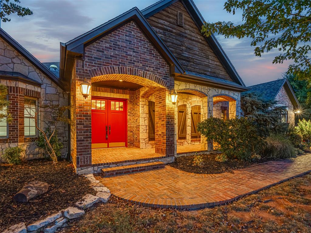 Remarkable craftsmanship, resort style living and energy conscious design come together in this custom residence, originally built as the builder’s personal home. A geothermal heating and cooling system designed for greater efficiency than conventional HVAC may help reduce ongoing energy costs. French inspired elegance blends with Craftsman warmth through rich woodwork, natural stone and distinctive architectural details. The grand entry opens to an inviting living room with wood flooring and a fireplace. Stone columns frame the formal dining room, while a private study with built in bookcases provides a handsome work from home retreat. Designed for entertaining, the bar and dedicated wine closet connect effortlessly to the main living spaces. The main level primary suite offers exceptional privacy and includes an integrated safe room. Its spa inspired bath features a clawfoot soaking tub and oversized walk in shower with steam feature. Two additional main level bedrooms each include private en-suite baths, offering flexibility for family or guests. The enclosed, climate controlled sunroom is a standout space, complete with a wood burning fireplace and panoramic views of the backyard and pool. Upstairs, a spacious bonus or game room, fourth bedroom and full bath create an ideal guest suite or additional living area. Backing to a peaceful greenbelt with no rear neighbors, the backyard feels like a private resort. Enjoy the pool and spa, relax beneath the pergola or entertain from the fully equipped outdoor kitchen. Storm resistant construction strapping, geothermal efficiency and custom craftsmanship provide comfort, durability and potential long term energy savings. A rare opportunity to own a thoughtfully designed home where architectural character, function and enduring quality meet.