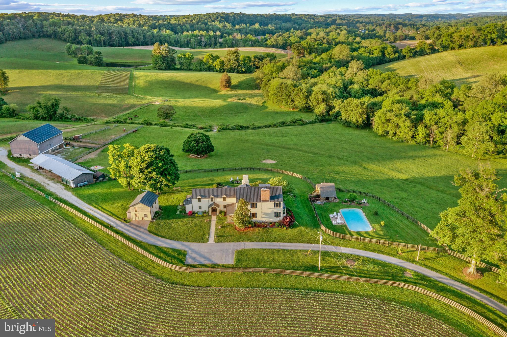 Welcome to Shoulderbone Farm – A Timeless RetreatNestled on 203 breathtaking acres, Shoulderbone Farm is a rare gem that seamlessly blends historic charm with modern luxury. This extraordinary property offers an unparalleled setting for horse and hound or those seeking a private country retreat.  The farm’s equestrian facilities feature a large bank barn with a spacious hayloft, eight stalls, a run-in shed, and a utilities shed that includes a heated tack room with a sink, ample space for farm equipment, and a two-car garage.  An automatic water system  runs throughout.  Multiple jumps are integrated into the fencerows, and expansive level areas provide the perfect setting for schooling in carriage driving, mallet sports, dressage, or jumping. "The Little Deer Creek" meanders gracefully through the property, adding to its serene beauty.  The residence is a striking blend of history and elegance. The six-bedroom, five-and-a-half-bath home features a newly renovated first-floor primary suite and an updated kitchen, both designed to honor the home's original character while embracing modern sophistication. The oversized sitting and kitchen area offer stunning, panoramic views of the pastures, creating a tranquil and inviting atmosphere. The original dining room, dating back to the 1700s, showcases a beautifully preserved fireplace, a testament to the home’s rich heritage. A charming spring house provides an additional private retreat, perfect as a reading nook or guest space with its own bath.  Beyond the barns and pastures, the estate boasts rolling fields, scenic ponds, and extensive riding trails, inviting exploration and outdoor enjoyment. Whether you envision an active equestrian lifestyle or a peaceful countryside escape, Shoulderbone Farm presents a truly unique opportunity to own a piece of Maryland’s countryside legacy.