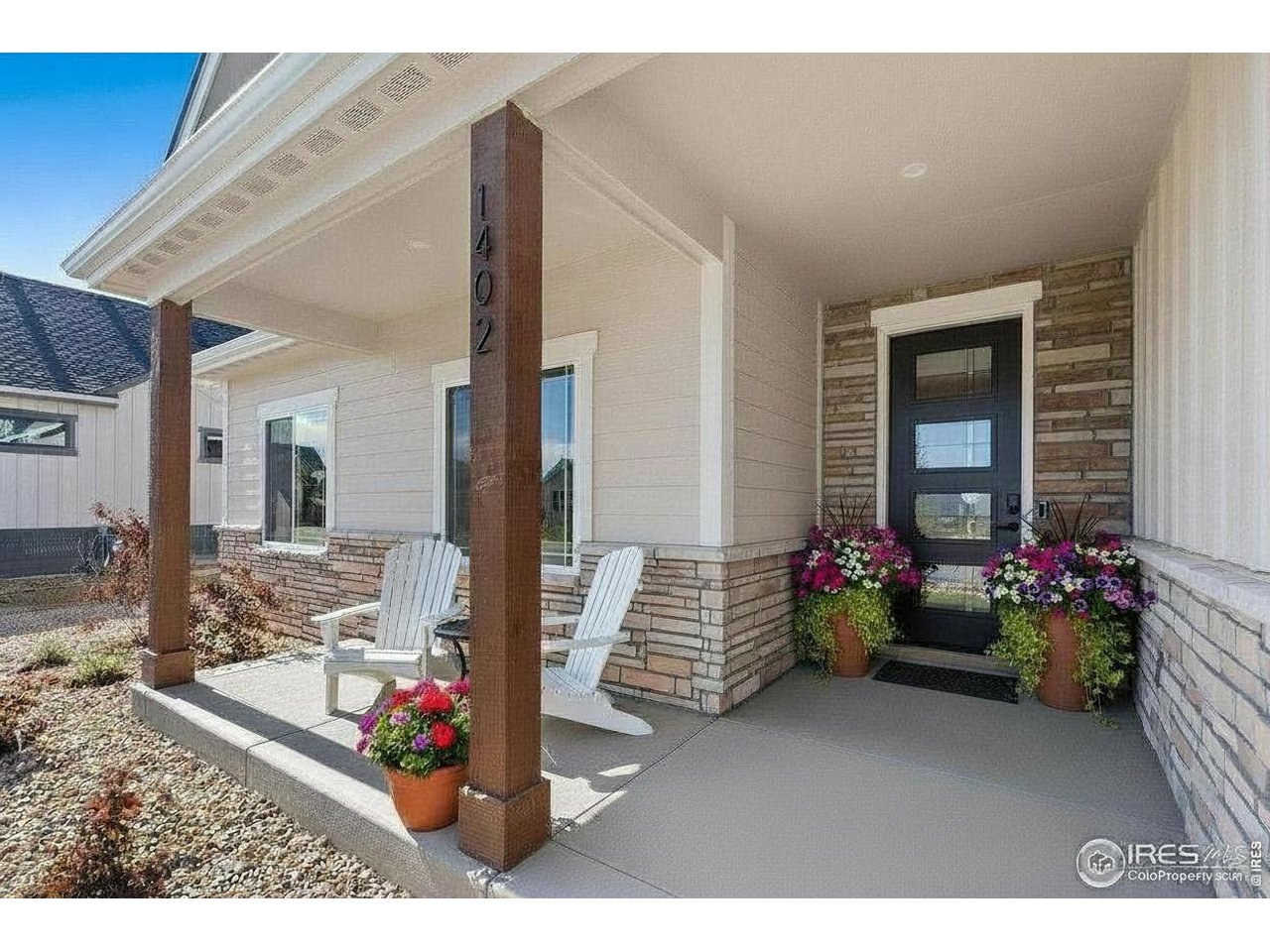 Welcome to The Ridgewood - where a smart floor plan, a bright sunroom, and a massive 4-car (1,012 sq ft!) garage come together in one of Berthoud's premier neighborhoods, Harvest Ridge.Step inside this well-built ranch and feel right at home. The spacious great room centers on a floor-to-ceiling travertine surround with an LED electric fireplace, finished with a rustic Douglas fir mantel for warmth and character.The kitchen is a standout, with richly stained birch cabinetry rising to 42" uppers topped by 18" toppers, plus extra cabinet space built into the back of the island. Quartz countertops run throughout the home, complemented by a stunning granite kitchen island, while recessed cabinet lighting, additional outlets, and toe-kick lighting round out the upgrades.The primary suite offers a private retreat with a shiplap accent wall, poured-pan shower, fully tiled double vanity with LED backlit mirrors, and a large walk-in closet. A versatile sunroom adds flex space for a home office, playroom, or quiet reading nook. Two more bedrooms sit on the main floor, with two additional bedrooms downstairs - ideal for family or guests.The basement also features a customized wet bar, perfect for entertaining. And with landscaping already installed, you can move in and start enjoying your wraparound covered porch right away. No Metro Tax District!