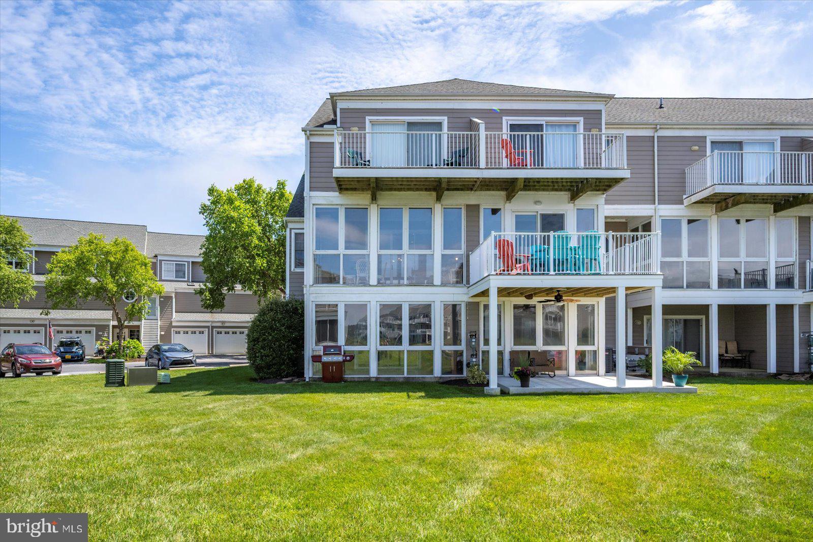 Newly Repositioned - 38277 Ocean Vista Dr #1180 is a beautifully maintained end-unit townhome in the sought-after waterfront community of Bayville Shores in Selbyville, Delaware. Recently refreshed with a lighter coastal look and updated décor, this spacious Court Model offers over 2,650 sq. ft. of upgraded living space, a builder’s bump-out that enhances the open layout and natural light, extra windows, added privacy, and unobstructed pond and bay views. Ideally located just 2.5 miles from Fenwick Island and minutes to Bethany Beach, Rehoboth Beach, Lewes, and Ocean City, MD, the home features a spacious entry-level guest suite or second primary bedroom with a bright waterfront sunroom, an open main level with 9' ceilings, sun-filled kitchen with skylight, dining area, living room with gas fireplace, and enclosed sunroom overlooking the pond and Little Assawoman Bay. Upstairs, the primary suite includes a private sundeck with water views, and a third bedroom with en suite bath completes the upper level. Bayville Shores offers exceptional amenities including pools, fitness center, community center, piers, private boat ramp, kayak and boat storage, tennis, pickleball, basketball, playground, walking paths, pondfront gazebos, and more. With water included, public sewer, low Delaware Electric Cooperative rates, HOA-covered exterior maintenance, flood and hazard insurance, and short-term rentals permitted, this coastal home offers outstanding value in a prime beach-area location.