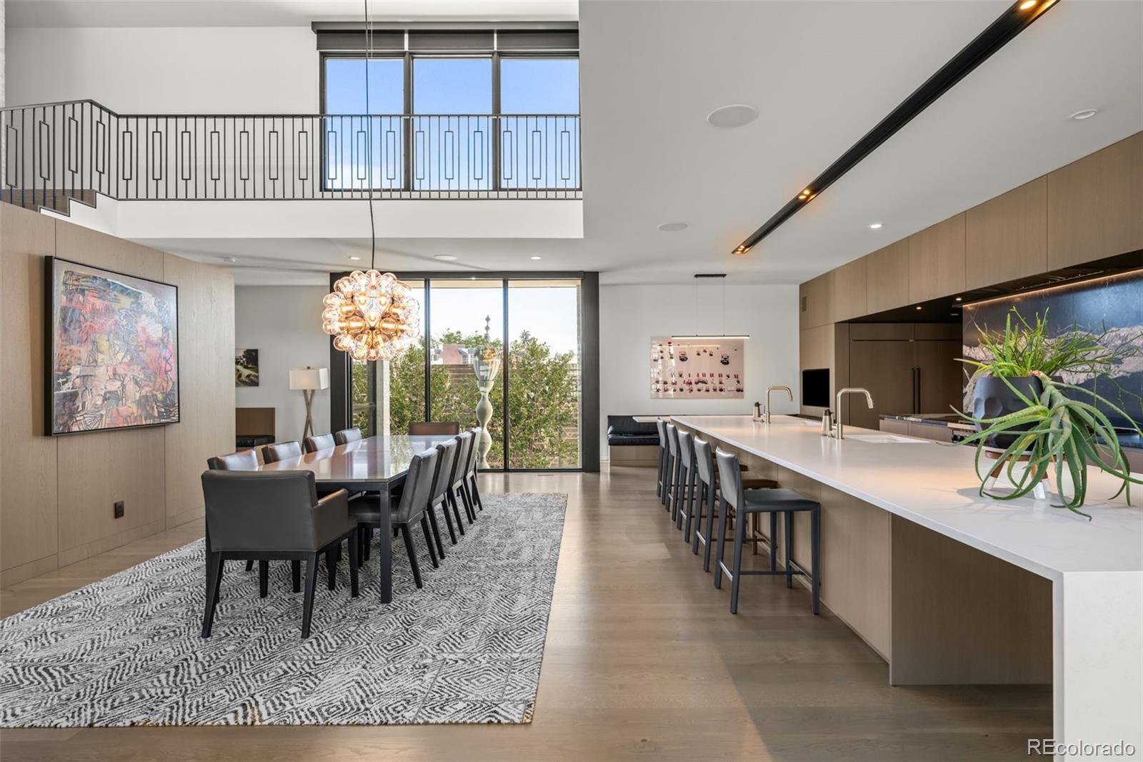 An exceptional offering in Cedar Estates, a private, gated enclave of just eight homes, this residence is slightly removed from the energy and congestion of Cherry Creek North, yet remains an easy walk to its renowned dining, shopping, and galleries—offering the perfect balance of privacy and urban convenience.Built by award-winning Montare Custom Builders and designed by BOSS Architecture, this luxurious home features four bedrooms and six baths, with a flexible lower-level game or bonus room that can easily serve as a fifth bedroom. Two main-floor offices complement an elevated primary suite with a sun-filled walk-in closet, private balcony, and spa-like bath.A standout design element, the industrial steel slide from the main living area to the lower level seamlessly blends style, function, and fun. A rare three-car heated garage with epoxy floors and private gated guest access enhances everyday convenience.Outdoors, a beautifully landscaped backyard and an enclosed breeze-block brick courtyard create two distinct settings for indoor-outdoor entertaining. The entire home—inside and out—is wired for whole-house Sonos sound.This one-of-a-kind residence delivers unmatched design, comfort, and lifestyle in one of Cherry Creek’s most coveted and discreet locations.