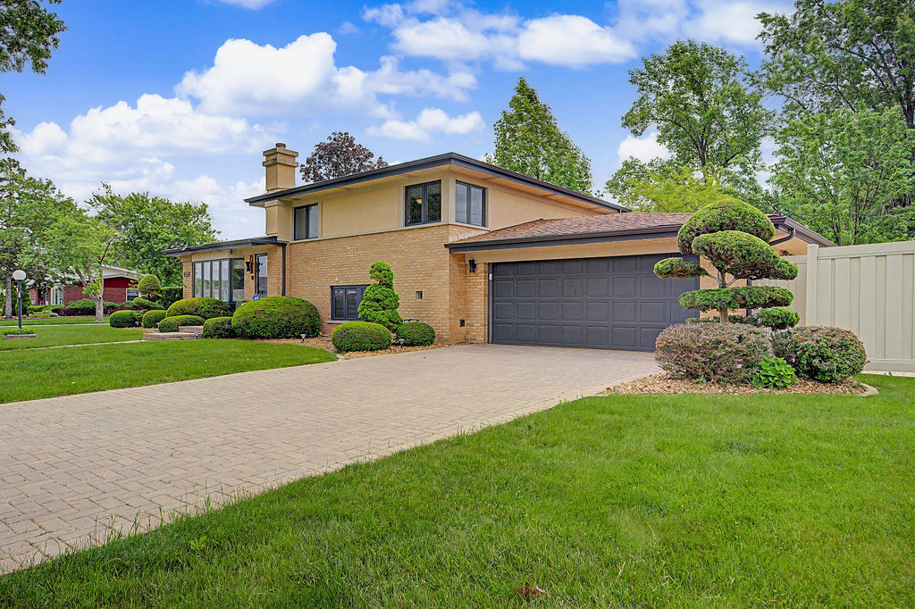 Welcome home to this beautifully updated residence offering a warm blend of comfort, style, and thoughtful design. The inviting living space features a modern fireplace focal point, recessed lighting, and a bright, open feel that makes it ideal for everyday living and entertaining. The kitchen is enhanced with high-end Dacor appliances and granite countertops, reflecting intentional updates chosen for both quality and a timeless look. Spacious bedrooms, hardwood floors, and a spa-inspired bath with a dramatic tiled surround and deep soaking tub add to the home's appeal. Conveniently located near Governor's State University, shopping, dining, parks, and major transportation, this home offers an excellent opportunity for buyers seeking value, convenience, and move-in-ready living in Chicago Heights.