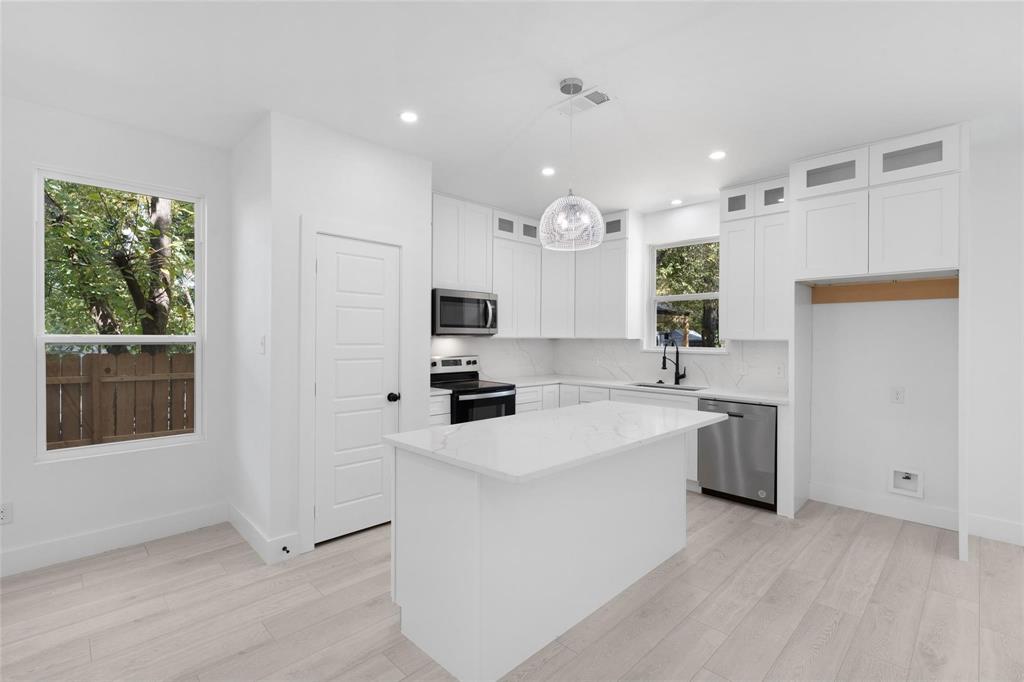 This elegant, contemporary home built in 2024 gives you peace of mind! Be the first one to own this stylish place. Luxury vinyl plank flooring provides a seamless flow throughout the main living areas plus recessed lighting that brightens the space. Down a foyer hall, the open floor plan makes the living area feel bigger. Enjoy cooking in the kitchen with granite countertops, stainless steel appliances, granite backsplash, a large island, and a walk-in pantry. The dining room gives you space for hosting guests. Walk-in closets give you storage for clothes in the bedrooms. The foyer includes access to the attached 1-car garage, a hall closet, and the laundry room. Patio doors in the dining room, give you access to a private backyard with wood fencing. A great opportunity to own your first home, downsize, or buy for investment!