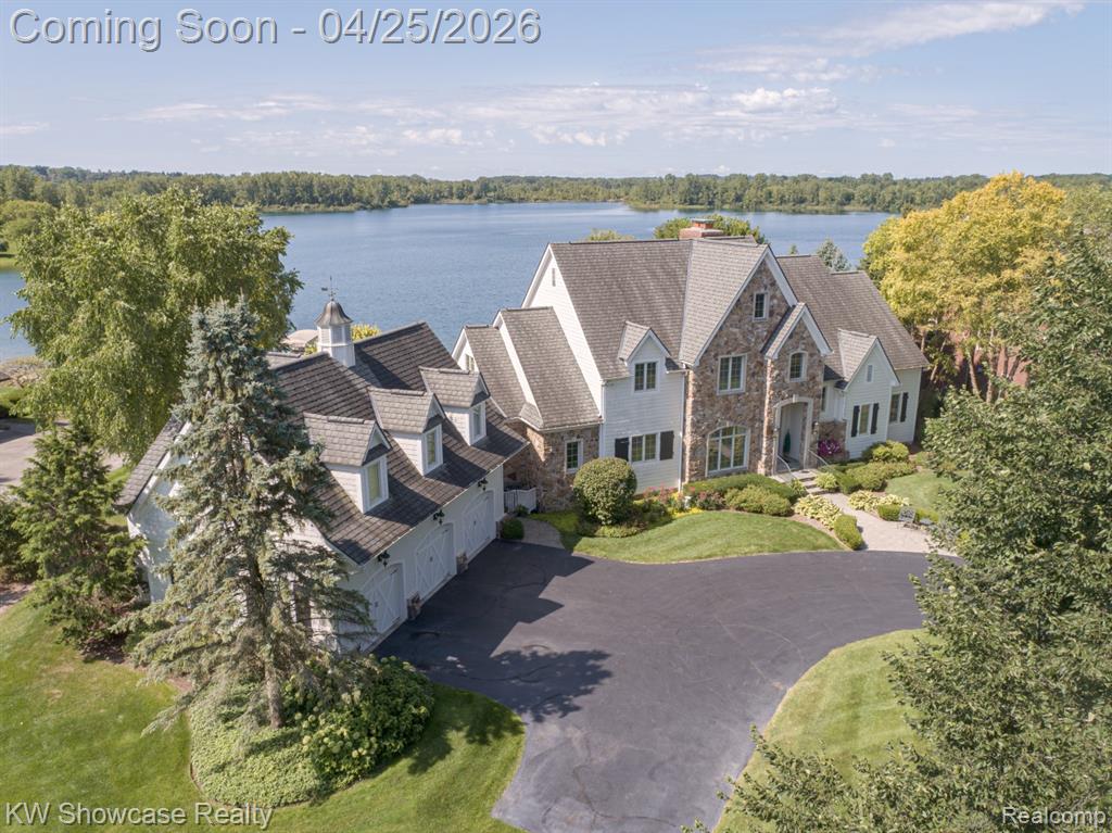 WELCOME TO SUNRISE LAKE!  THIS PRIVATE, ALL SPORTS LAKE IS MOSTLY UNDEVELOPED, OFFERING A NATURAL PRISTINE SETTING! THIS MAGNIFICENT MANOR IS LOCATED ON A QUIET, DEAD END STREET AND SITUATED ON A LARGE (1.88 acre) BEAUTIFULLY LANDSCAPED LOT INCLUDING AN ELEVATED TERRACE, HUGE PAVER PATIO, BOULDER LINED BEACH AND 97 FEET OF SHORELINE. Descriptions cannot do the home justice, It's a must see! The stunning home features an open floor plan with over 8,500 Square Feet of living space, soaring ceilings, an extensive use of glass, rich hardwood and luxurious appointments throughout. The desirable layout includes a first floor Owner's Suite, first floor Laundry Room, finished Lower Level Walk-Out, 3 Car Garage, and a  fantastic In-Law Suite!  The covered entry leads to a two-story Foyer and adjoining Dining Room. Beyond the Foyer features lies a two-story Great Room with stone fireplace and wall of windows facing the lake. The Gourmet Kitchen is furnished with custom cabinetry, granite counters, premium SS appliances and snack-bar. The Breakfast Nook is surrounded by windows and a French door leading to the terrace. The wonderful Owner's Suite includes 2 walk-in closets and elegant Ensuite with luxury jet tub. Upstairs 4 spacious Bedrooms, each with a ceiling fan/light and walk-in closet, share two Buddy Baths. The beautifully finished lower level features a huge Family/Rec Room with stone fireplace and French doors leading to the paver patio, Bar/Kitchenette, Gaming Room, Bedroom, Flex Room and full Bath.  Separated for Privacy, the In-law Suite includes a Living Room, Full Kitchen, Bath and Bedroom area.  The home generator runs essentials in the home. Not a whole house generator. AGENTS: PRE-APPROVAL LETTERS/PROOF OF FUNDS NEED TO BE PROVIDED PRIOR TO SCHEDULING A SHOWING.