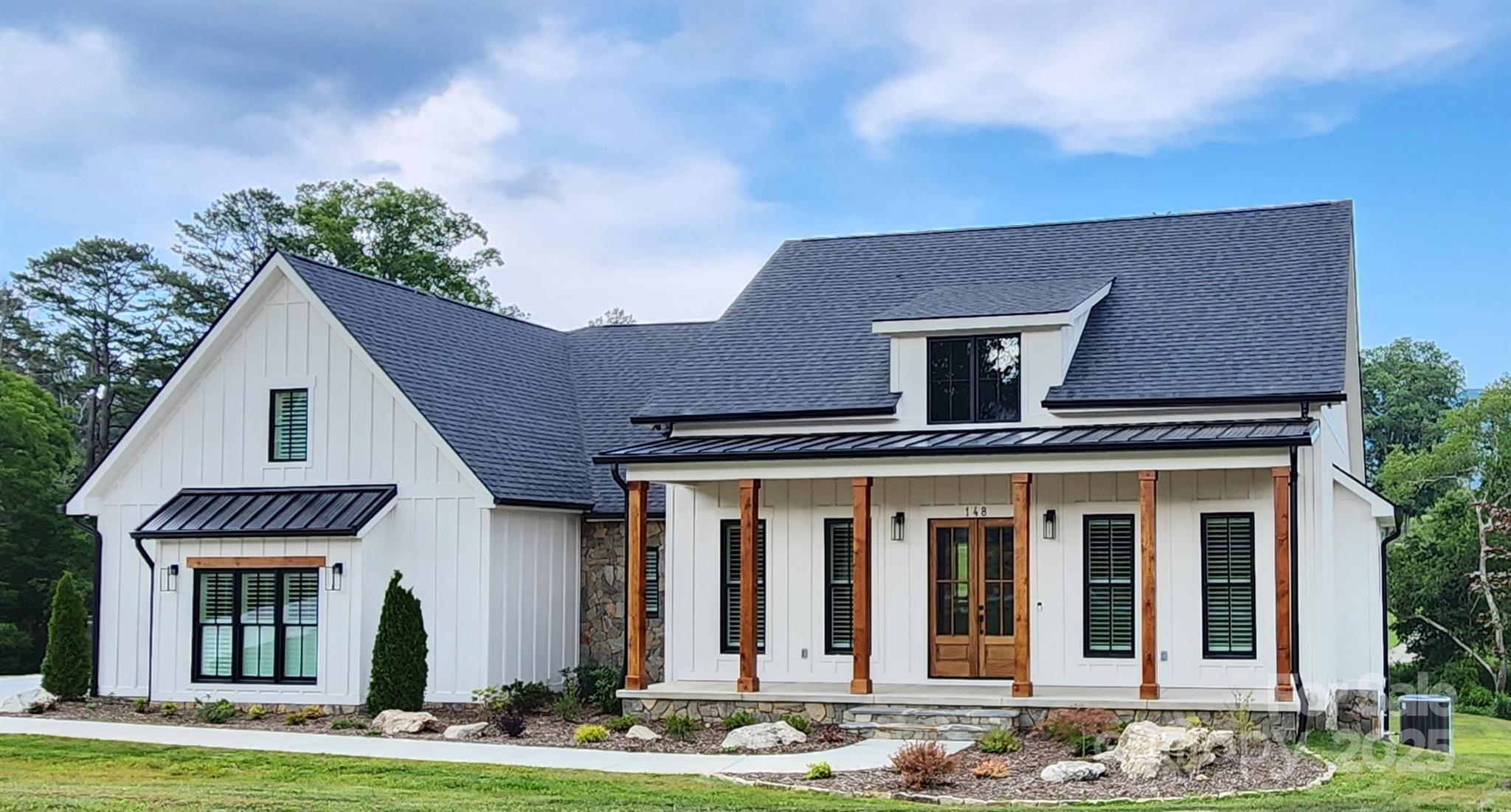 Horse Haven in Cane Creek Valley! Dreaming of the ultimate equestrian lifestyle? Welcome to your private paradise, 9.09 acres of mostly fenced pastureland nestled in the Cane Creek Valley. Imagine your horses grazing freely across open fields with a creek running through the property, adding to the natural charm. Equestrian-Ready & Designed for Wellness This property features a spacious 6-stall barn, multiple paddocks for personalized care, and a thoughtfully designed track system to promote healthy movement and happy horses. It's the ideal setup for any equine enthusiast! Privacy, Panoramic Views & Country Charm. Enjoy the best of peaceful country living with picture-perfect mountain vistas as your backdrop—just 20 minutes to downtown Asheville and only 5 minutes to the local brewery and grocery. A prime homesite is perfectly positioned to soak in the scenery every day. Don’t miss your chance to own a rare piece of equestrian heaven in the heart of Fairview’s Cane Creek Valley. A PROPOSED BUILD: Beautiful 3 bd/3.5 ba modern farmhouse. The grand entry and dining room open into a large open living area with vaulted ceilings and wood accent walls. The Lg kitchen has views to the rear porch and features an island with an LG butler pantry—main-level living at its finest. The bonus space could be your 4th bedroom, an office, or a family game room. Wonderful family room, exercise room, and full bath in the daylight basement. Massive back-covered deck to enjoy the views.