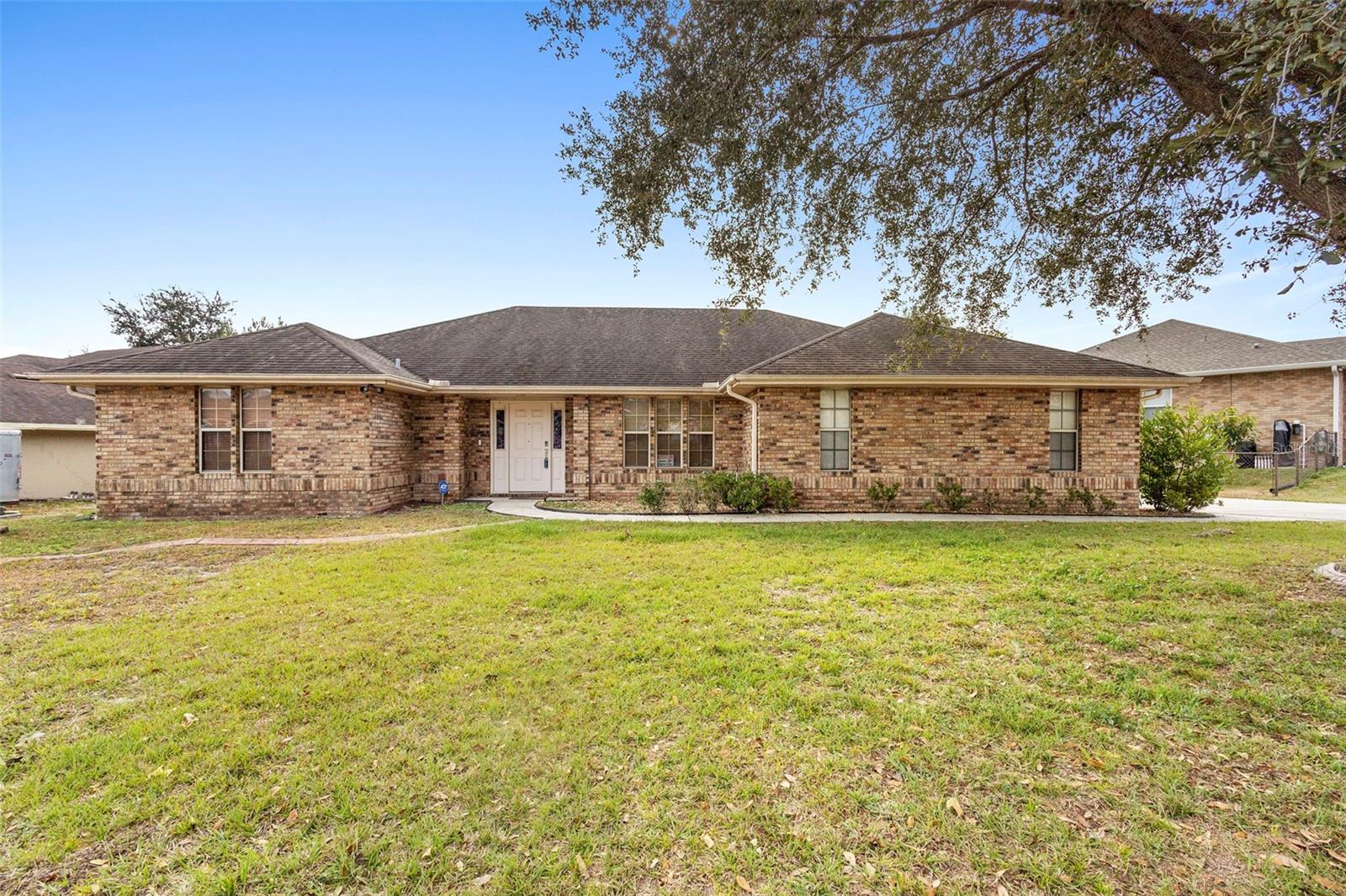 Welcome to 1195 N Old Mill Drive, a golf-front, 3 bedroom +Office POOL-HOME located on the beautiful Deltona Golf Club. This custom built, split floor plan home offers the perfect blend of elegance, comfort, and modern living. NEW ROOF JUST INSTALLED.  Nestled on a spacious 0.27 acre lot, this property is a true gem. 2,038 sq feet including 3 bedrooms, private office, 2 bathrooms, 2 car garage, an incredible screened pool and spa patio area out back and a 10x8 rear shed. Step inside the front door and be greeted by the foyer looking into the formal living room complete with skylights,  the owner’s suite is on your left, private office on your right and then into the kitchen and family room, then further down to the other two bedrooms, each with their own walk in closet. The Owner’s suite is a serene retreat, complete with a brand new luxurious updated ensuite bathroom, large walk-in closet, custom rainfall shower, raised double vanity, large walk in linen closet and easy pool access through French doors. Gourmet kitchen featuring oak cabinets, bar seating, dinette breakfast eating area, closet pantry and more. Next up is the large family room with plenty of space for family and guests.  Includes a beautiful fireplace for those cool evenings.  Two additional well-appointed bedrooms both with large walk-in closets and the guest bathroom with lined closet are beyond the family room. Inside utility room includes a washer and dryer. Complete home was painted a year ago and the garage floor has epoxy finish.  Enjoy the Florida sunshine in the backyard oasis, where you'll find great views of the golf course. Spectacular oversized covered and screened rear pool, spa and patio area, perfect for entertaining or simply relaxing. With its convenient location close to I-4, you'll have easy access to shopping, dining, doctors, beaches, hospitals along with many entertainment options. Don't miss the opportunity to make this exquisite home yours. Schedule a showing today and experience the luxury and lifestyle that awaits you.