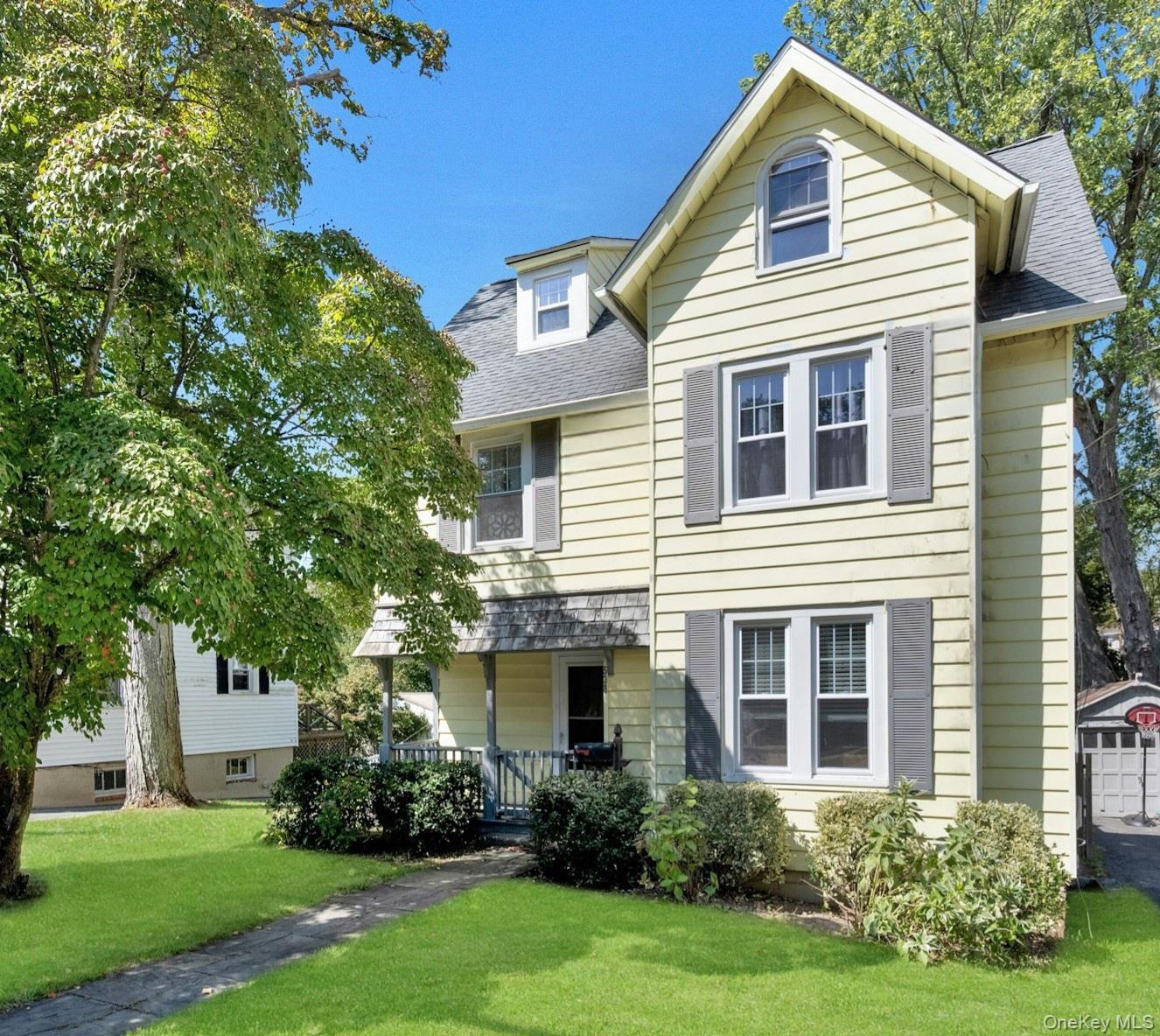 Charming 3 bedroom 1.5 bath home in the heart of the Pocantico Hills Hamlet.  Old World charm with modern updates. Just a short walk to the school, pool, tennis, and pickleball courts, surrounded by Rockefeller walking trails, this home offers an ideal blend of location and lifestyle. Upon entering, you'll find an inviting entry hall that leads to a lovely living room with gleaming hardwood floors and lots of natural light.  Living room opens to  dining room with door out to deck, perfect for entertaining . Beautiful updated kitchen  with stainless steel appliances, quartz counters and lots of modern cabinetry, hall to 1/2 bath and pantry. Upstairs, you'll find a primary bedroom, two additional bedrooms, and an updated  hall bath with double sinks. Bonus room approx. 465 sq feet. Unfinished basement approx. 500 sq ft. Pocantico Hills School provides a comprehensive program from Pre-K (for 3 and 4-year-olds) to 8th grade, with high school options at Briarcliff, Pleasantville, and Sleepy Hollow. Residents enjoy access to an Olympic-sized swimming pool, tennis and pickleball courts, basketball courts, playgrounds, and ball fields—all with the benefit of low taxes. Don't miss the chance to make this exceptional home yours!