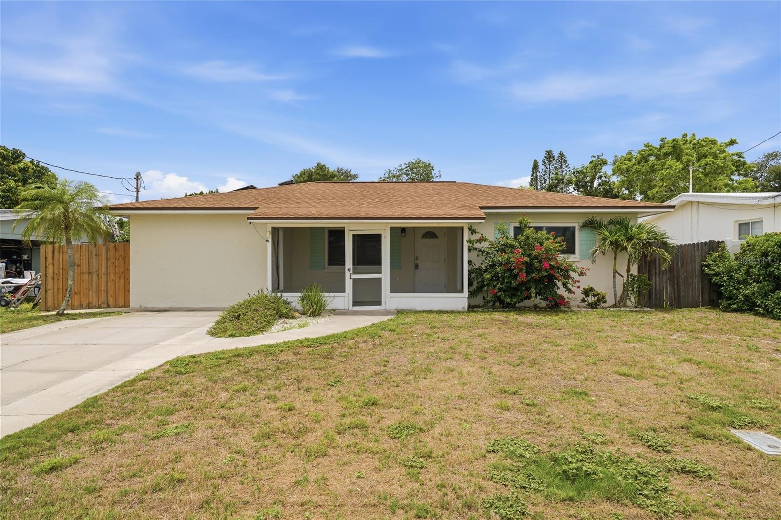 Discover the perfect blend of location, comfort, and efficiency in this beautifully updated Largo home just moments from the Gulf Coast beaches. Offering 3 bedrooms and 2 full bathrooms, this inviting residence features a spacious split-bedroom floor plan with multiple living areas filled with natural light. The updated kitchen is equipped with granite countertops, stainless steel appliances, and ample cabinetry, while both bathrooms have been tastefully renovated for a modern feel. Major improvements including a newer roof, updated A/C, impact-rated windows, fresh paint, and a brand-new water heater provide added value and peace of mind. Designed with energy savings in mind, the home also includes a fully owned solar system, radiant barrier insulation, and solar-powered attic fans. Enjoy outdoor living from the large screened rear porch overlooking the expansive fenced backyard with plenty of room for a future pool, garden, or entertaining space. Located in a non-flood zone and no evacuation zone with short-term rental potential under county rules, this property is ideal as a primary residence, vacation retreat, or investment opportunity. Conveniently close to shopping, dining, schools, and world-famous beaches, this home captures the best of Florida living.