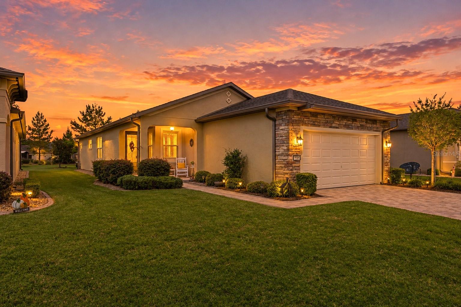 Discover how beautifully you can live large in a smaller footprint in this move-in-ready Taft Street Garden Home, located in the desirable Arlington neighborhood of Stone Creek, a premier 55+ active adult community. Enjoy the convenience and value of lawn maintenance, internet, and irrigation costs included, helping simplify your monthly expenses and giving you more time to enjoy the lifestyle you deserve. Whether you're looking for a full-time residence or the perfect seasonal retreat, this inviting home is ready for you to move right in! The well-appointed kitchen is designed for both style and functionality, featuring granite countertops, soft-close cabinetry, convenient soft closed adjustable pullouts, a spacious pantry, and extra lighting that creates a bright, welcoming atmosphere. Diagonal tile flooring and grout throughout the main living areas has recently been cleaned, regrouted, and color sealed, while luxury vinyl plank flooring in the bedrooms and closets offers attractive, easy-care durability. Plantation shutters throughout, ceiling fans in every room, and taller ceilings and doors enhance the home's comfortable, spacious feel. Extend your living space outdoors with the extended lanai and birdcage, perfect for relaxing or entertaining. The established landscaping adds curb appeal, while the large backyard common area and privacy berm create an appealing sense of separation and privacy. An extended garage provides valuable extra storage, and the Pelican water filtration system is another thoughtful addition. Recent improvements include a replacement garage door opener in 2023 and exterior painting in 2024. With these updates, attractive finishes, and three valuable costs already included—lawn maintenance, internet, and irrigation—this home offers the perfect opportunity to simplify everyday living without sacrificing comfort or lifestyle. Discover the vibrant Stone Creek lifestyle! With approximately 200 clubs and interest groups, there are endless opportunities to explore hobbies, make new friends, and stay connected. The community's Active Lifestyle Office coordinates a variety of entertainment options and activities, making it easy to fill your calendar with fun. Enjoy two swimming pools, with another under construction, two clubhouses, and a spectacular clubhouse featuring a large bar overlooking a lake. Sports enthusiasts will appreciate the variety of recreational opportunities, including pickleball and golf, along with so many other ways to stay active and engaged. At Stone Creek, you can truly enjoy the best of both worlds: a thoughtfully designed home that's easy to maintain and a community filled with opportunities for recreation, entertainment, and connection. Live large, enjoy more, and spend less time on upkeep in this wonderful Stone Creek home!