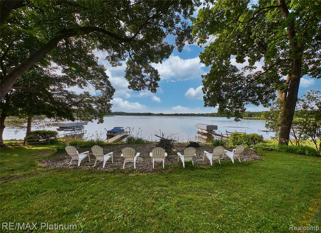 A rare Brighton offering featuring two exceptional parcels, including a premier buildable lakefront lot on all-sport East Crooked Lake. With 90' of frontage, walkout/daylight potential, mature trees, sandy-bottom shoreline, and stunning sunsets, it’s the ideal canvas for your dream home. The adjoining 1+ acre parcel includes an updated home with a split available—live there while you build your lakefront dream home.  Then convert the existing home to a rental property/guest house, this is a winning way to build and generate income!
