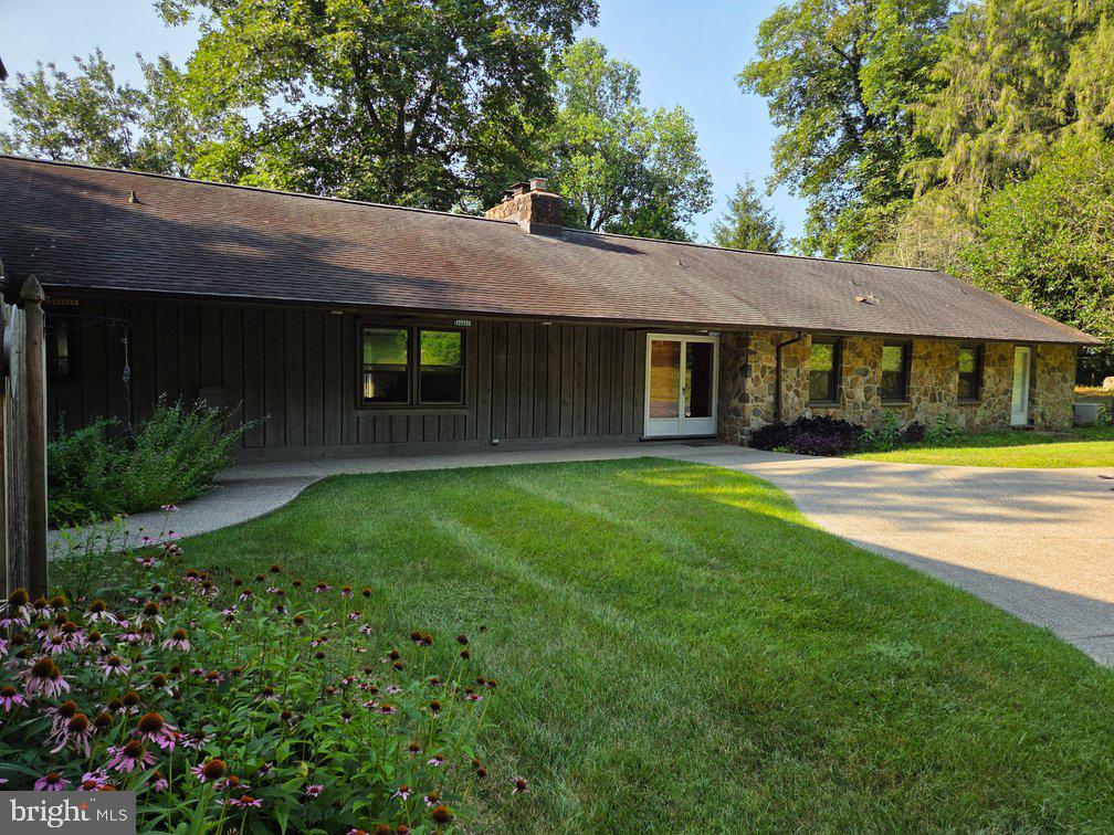Upcoming Auction October 3rd @ 1pm. A Long Tree Lined Lane Leads to This Private Setting w/4 Bdrm. 3 Full Baths, 2-Half Baths, 1-Story Home on 5 Acres, Attached 2 Car Garage w/Apartment/In-Law Suite Above The Garage w/1 Bedroom, 1 Bath, Kitchen & Living Room. MAIN LEVEL: The Home’s Double Doors Open To A Spacious Tile Entry Floor. The Entry Also Offers A Convenient Coat Closet and Lovely Powder Room With A Sink and Vanity.The Entry Expands To The Grand Great Room With Its Spectacular Floor-To-Ceiling Stone Fireplace, The Vaulted Ceiling is Handsome With LargeBeams and Special Lighting, Three Sliding Glass Doors To The Expansive Deck Overlooks The Natural Private Views. THE KITCHEN: Features ABar Opening To The Great Family Room, Custom Cabinetry, Formica Countertops. DINING ROOM: Is Just Off The Kitchen Overlooking BeautifulLandscaped Views. Also From Here You Will Find Access to the Outside and a Refreshing Screened-in Patio, A Hallway From Kitchen Leads toLaundry Room & Half Bath and Access to the 2-Car Garage Area, A Quiet Hallway Leads From The Entry to the Bedroom Areas of the Home. HereYou Will Find 4-Good-Sized Bedrooms Including a Master Suite, Most of Bedrooms Are En-Suite and All Off er Large Walk-in Closets. Attic is Accessed Through the Master Suite’s Walk-in Closet and Offers Additional Storage. BEDROOM #1: Master Suite, Carpeting, Large Double WindowsAnd A Private Full Bathroom With An Oversized Shower And A Sink w/Vanity. BEDROOM #2: Carpeting, Full Bathroom w/Vanity and Shower/TubCombination. BEDROOM # 3: Carpeting, Double Windows, Ceiling Fan, Linen Closet, A Private Full Bathroom with a Bathtub/Shower Combination. BEDROOM #4: Carpeting, Outside Access, Grown-Child Suite. APARTMENT/IN-LAW SUITE: The Second Floor Apartment is Accessed by2-Outside Sets of Stairs. This Charming Suite Offers A Bedroom, Kitchen, Small Living Room and a Full Bathroom. The Bathroom Has a Bathtub/Shower Combination and a Vanity, Closet with Built-In Shelves and Laundry Facilities. Kitchen Features an Electric Range-Microwave, DoubleStainless Sinks, Oak Cabinetry, Formica Countertops Including A Large Peninsula, Breakfast Bar, The Suite Also Has A Screened Porch. TheApartment Is Metered & Cabled Separately. BASEMENT: Full Basement Area With A Living Or Entertainment Area on 1/2 of the Space Includes AMasonry Fireplace, The Other 1/2 of the Basement Could Be Used As A Workshop or Hobbyist Dream Hangout. The Home Has a 275 Gal. Oil Tankand is Heated With Hot Water Heater. IN-GROUND POOL: Outback In-Ground Pool Surrounded With Concrete Patio for Your Relaxation or FamilyParties. THE DRIVEWAY: Is Adorned With Stone Walls and Evergreen Trees, Asphalt Driveway With Parking Area. Large Front Yard With Mature Shrubbery, Landscaping, Small UtilityShed, Woodlands with Wildlife, Deer andSo Much More. This Is A Shared Driveway for A Property Back From This One.