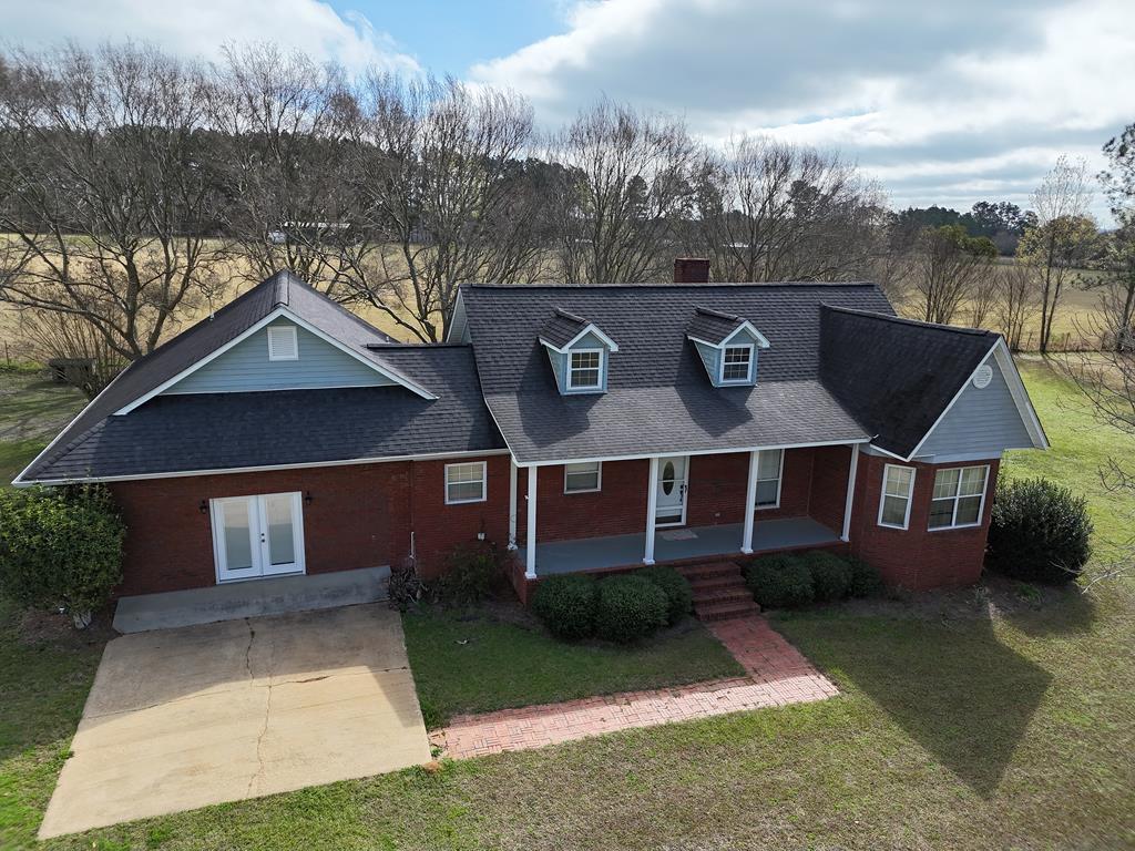 You have to see this AMAZING BRICK HOME on Vonier Rd. in Thomas County! Nestled on 6 acres, this 3BR/2.5 Bath has all the country charm you have been looking for. Inside you will find a spacious fireside living room, an enormous den with French doors, a great kitchen and dining area. The primary suite has its own full bath and walk-in closets, and there are two more rooms at the opposite end of the house. Enjoy your coffee on the picturesque front porch, or look out over the fields on the HUGE back deck. Property includes a big storage building/workshop, large open front yard, mature pines, and MORE. Call your favorite agent TODAY for a closer look at this amazing home. Click here for a virtual tour: https://my.matterport.com/show/?m=PjA6Fqp3rVk&mls=1