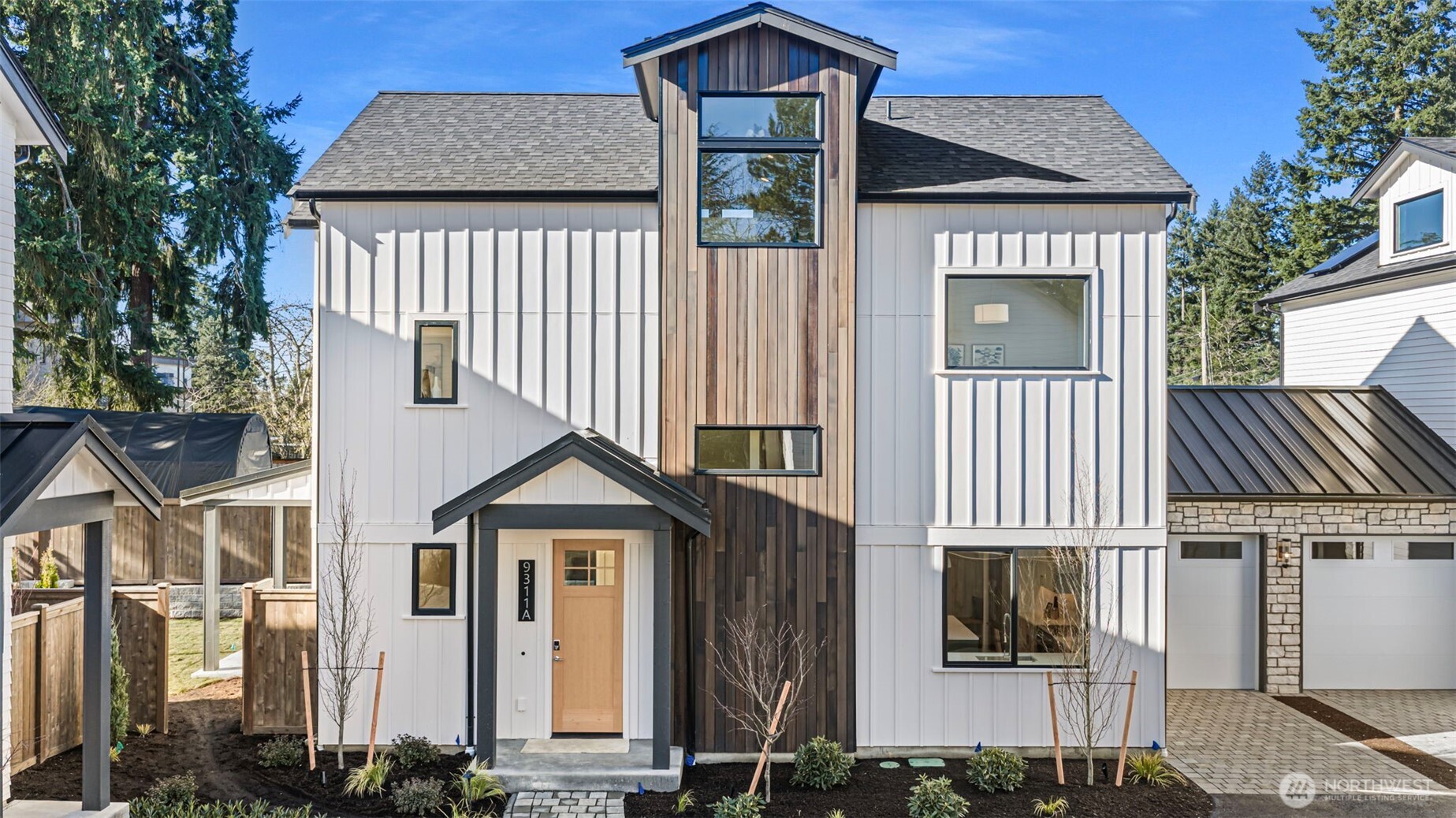 Discover sophisticated living in this beautifully built new home by Jake’sD, tucked away on a quiet dead-end street in Rose Hill. Thoughtfully crafted for both style and everyday ease, this 3-bedroom, 2.75-bath residence features an open, flowing layout designed for modern living. Striking Northwest Contemporary architecture is complemented by upscale finishes and expansive windows that fill the home with natural light. At the heart of the main level is a chef-inspired kitchen with a large island and premium appliances, creating the perfect hub for entertaining or daily gatherings. Upstairs, the spacious primary suite provides a peaceful retreat with a walk-in closet and a spa-like bath designed for comfort and relaxation. The top level adds even more versatility with a generously sized bonus room—ideal for a media space, workout area, or home office—along with a convenient half bath. Step outside to enjoy the fully fenced yard, beautifully landscaped for both privacy and outdoor enjoyment. The home also features solar panels for added efficiency. Located just minutes from downtown Kirkland’s vibrant shops, dining, and waterfront, this exceptional property combines thoughtful design with an unbeatable location. A one-car garage with EV charging plus an additional parking space adds everyday convenience.